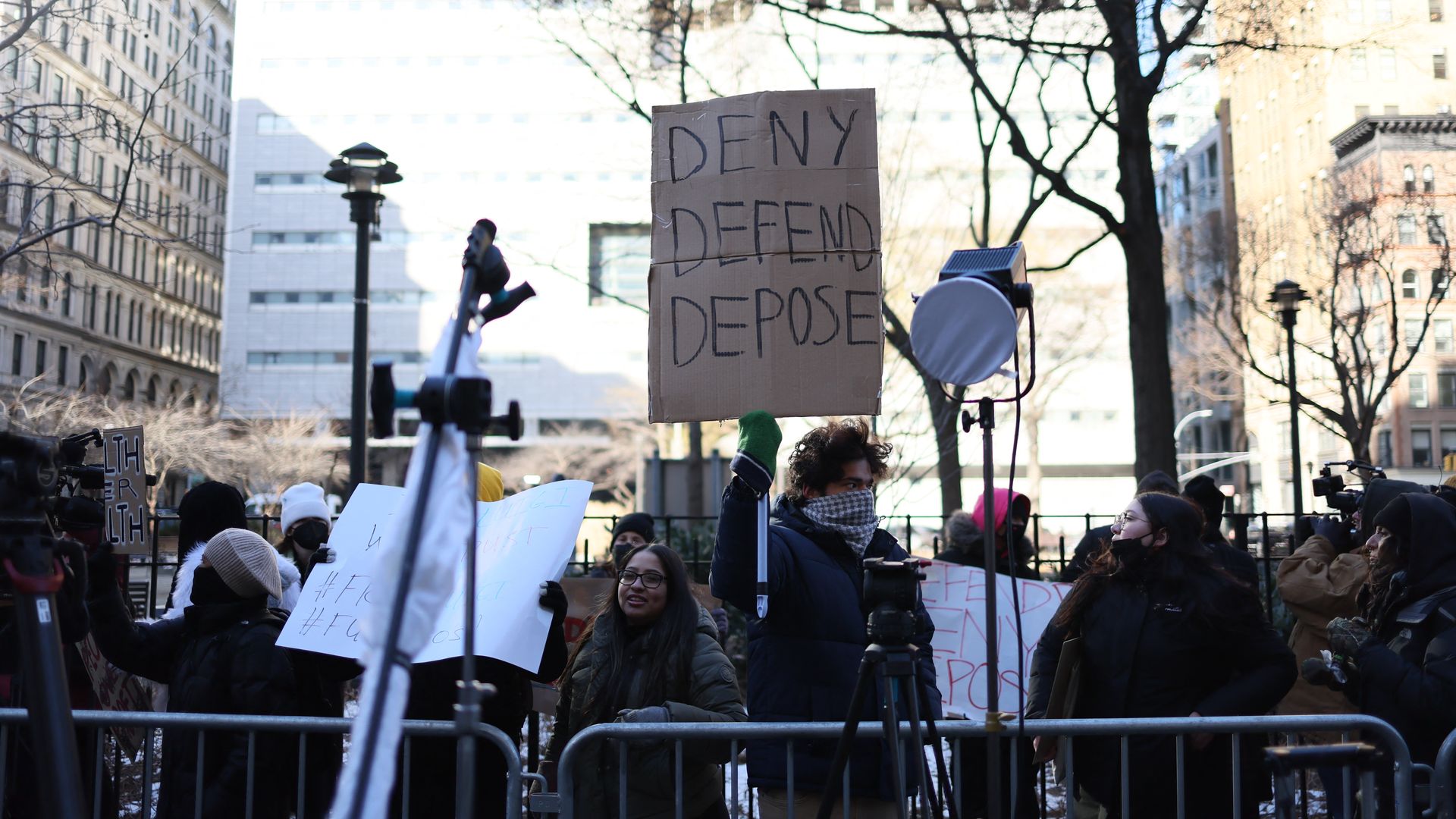 People demonstrate outside Federal Criminal Court where Luigi Mangione, suspect in the killing of UnitedHealthcare CEO Brian Thompson, appears during an arraignment hearing on Dec. 23, 2024, in New York City. 