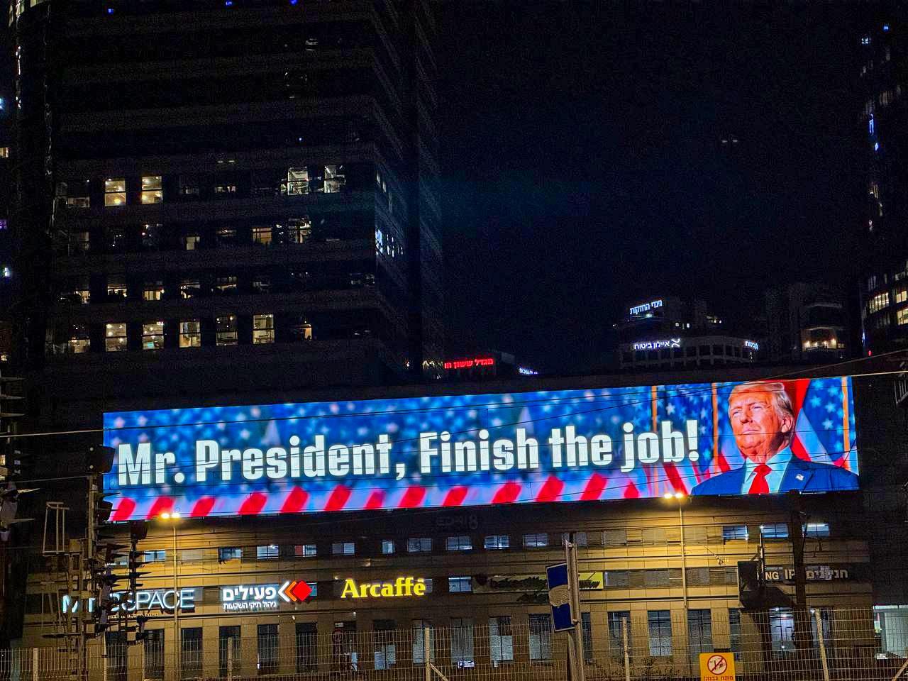 A billboard seen yesterday in Tel Aviv, Israel, calls for President Trump to "finish the job."