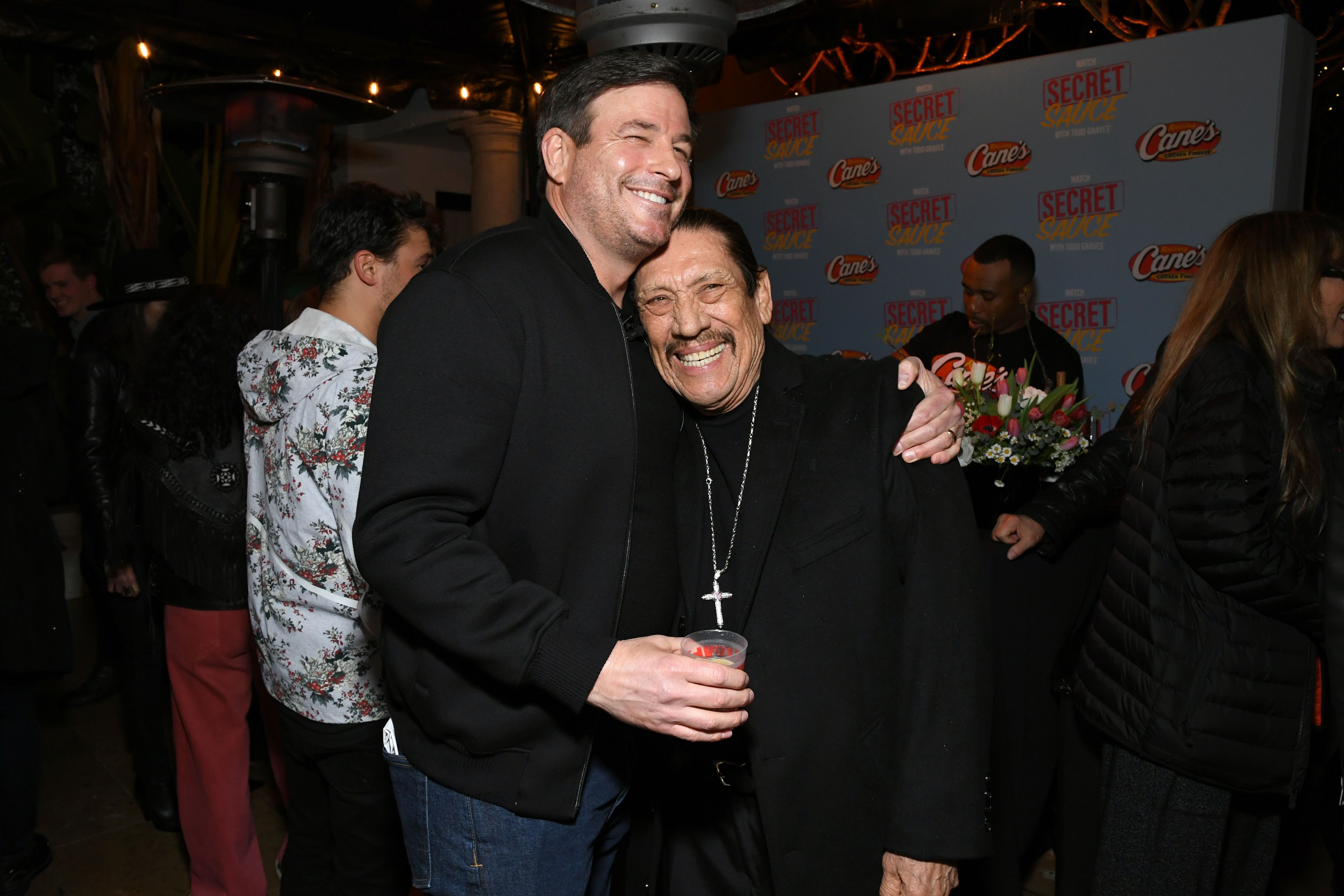 Photo shows Todd Graves and Danny Trejo hugging