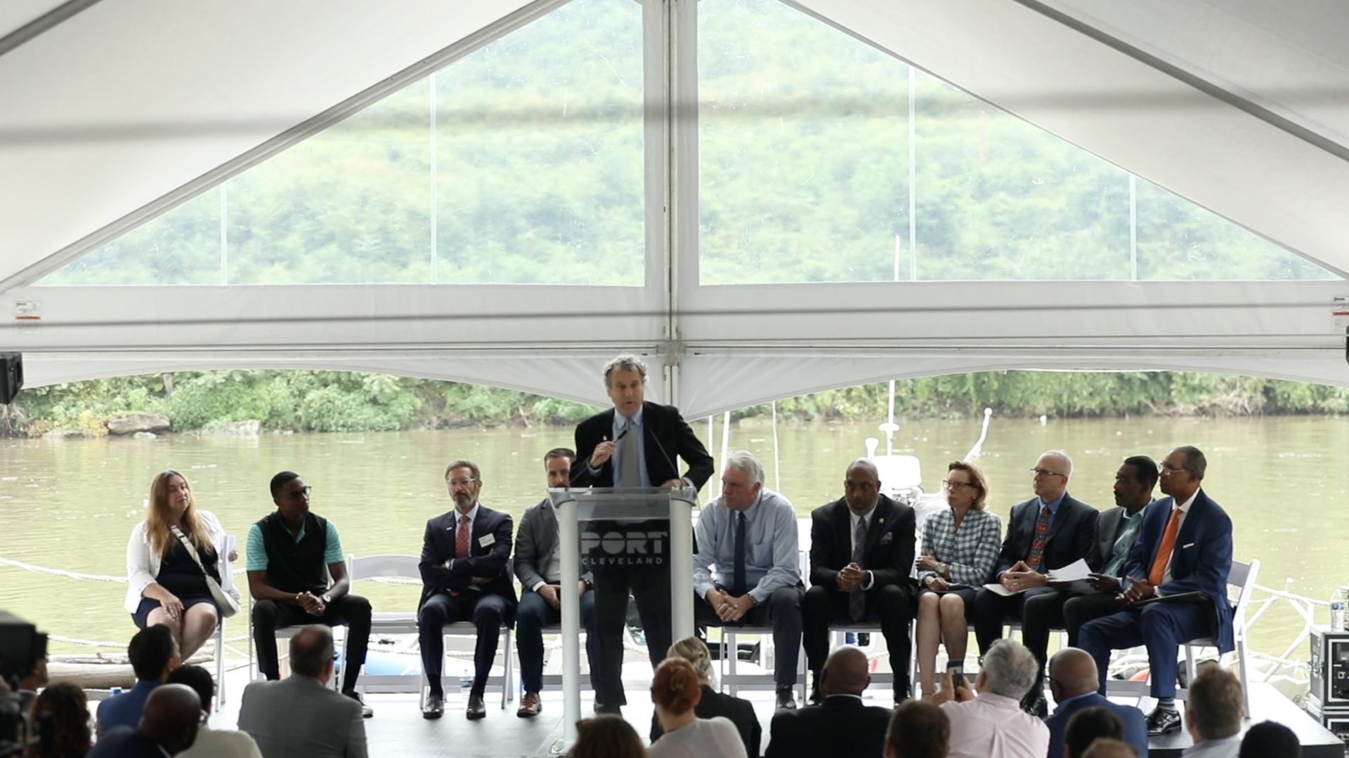 Sen. Sherrod Brown speaks at the groundbreaking event Friday, the Irishtown Bend hillside at his back.