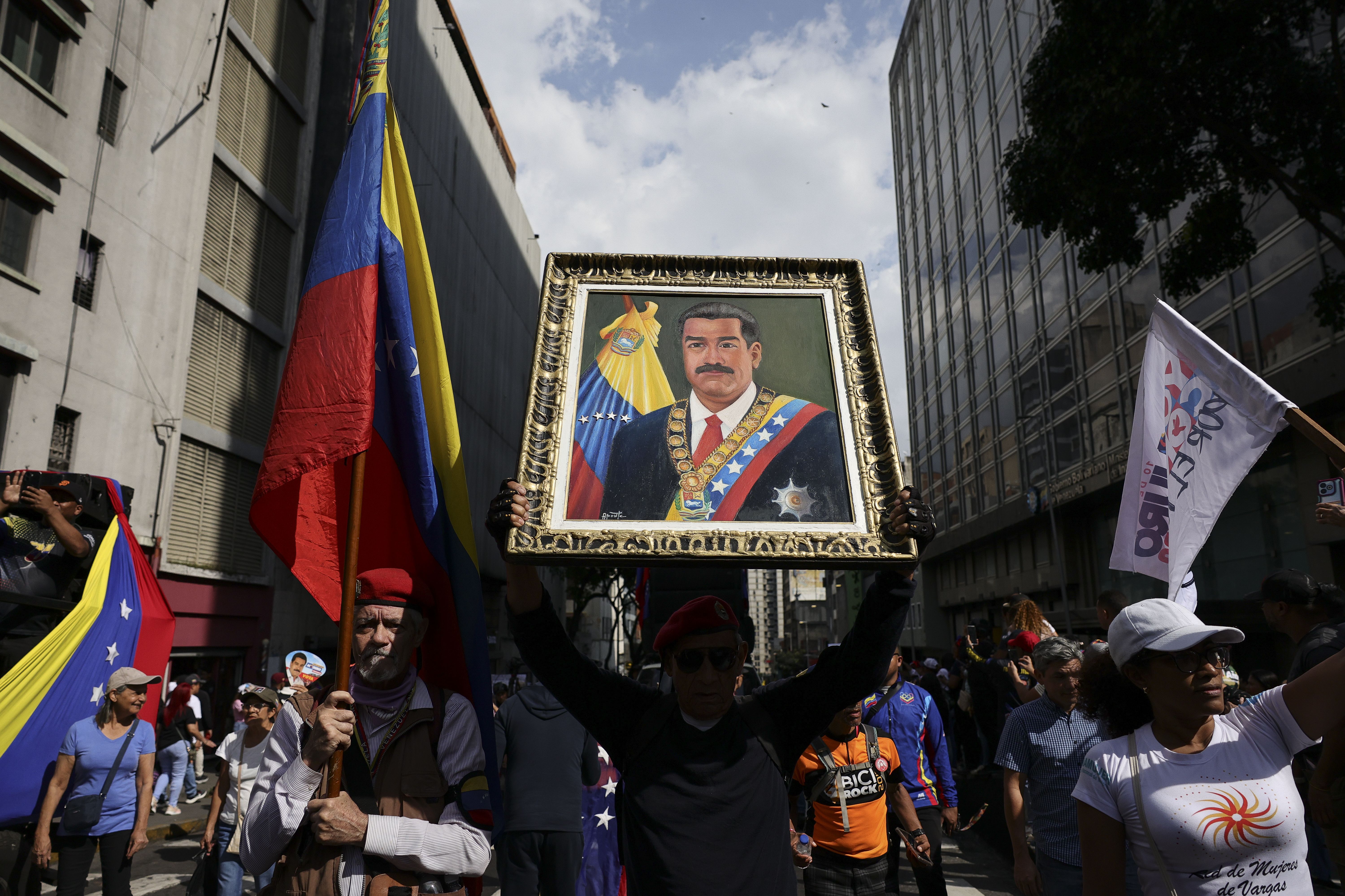Supporters of Nicolas Maduro march yesterday in Caracas, Venezuela.