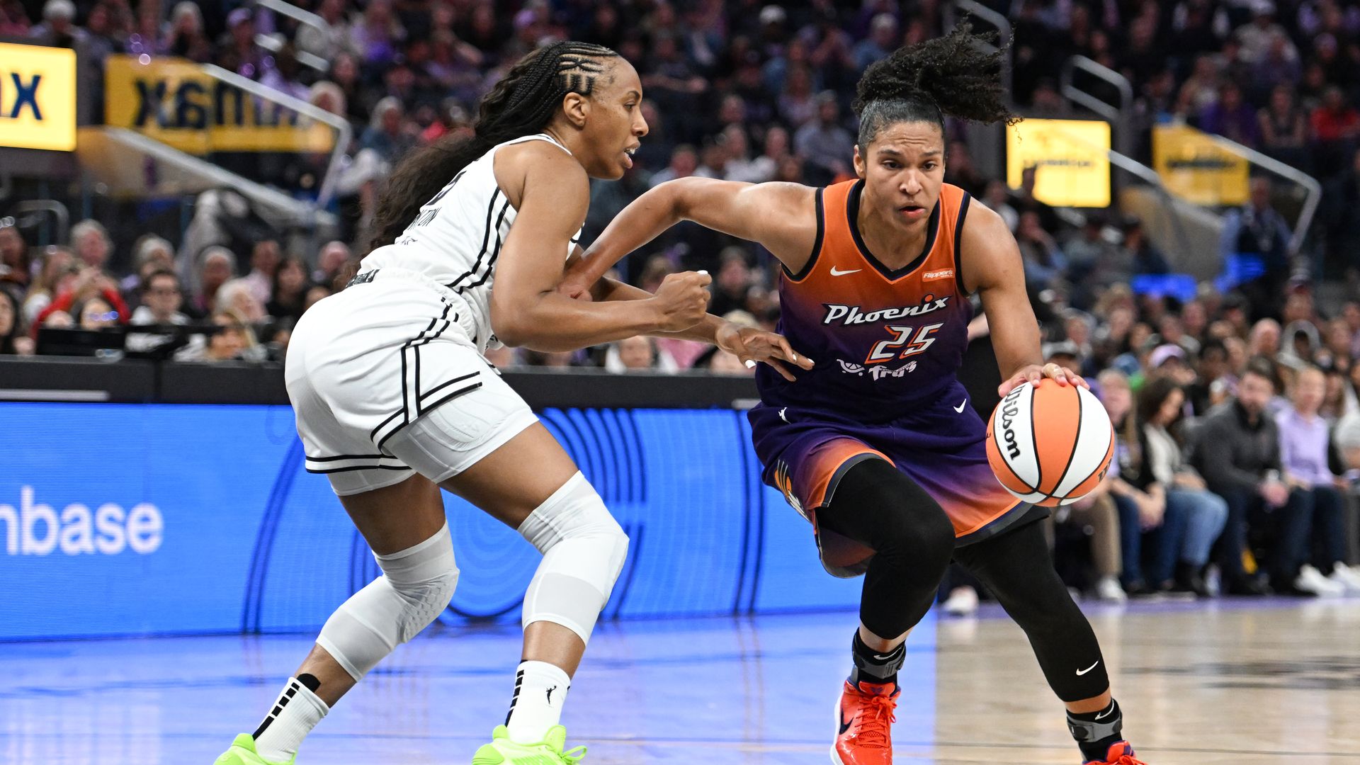 Alyssa Thomas drives with the basketball against Kayla Thornton during a game between the Phoenix Mercury and Golden State Valkyries. 