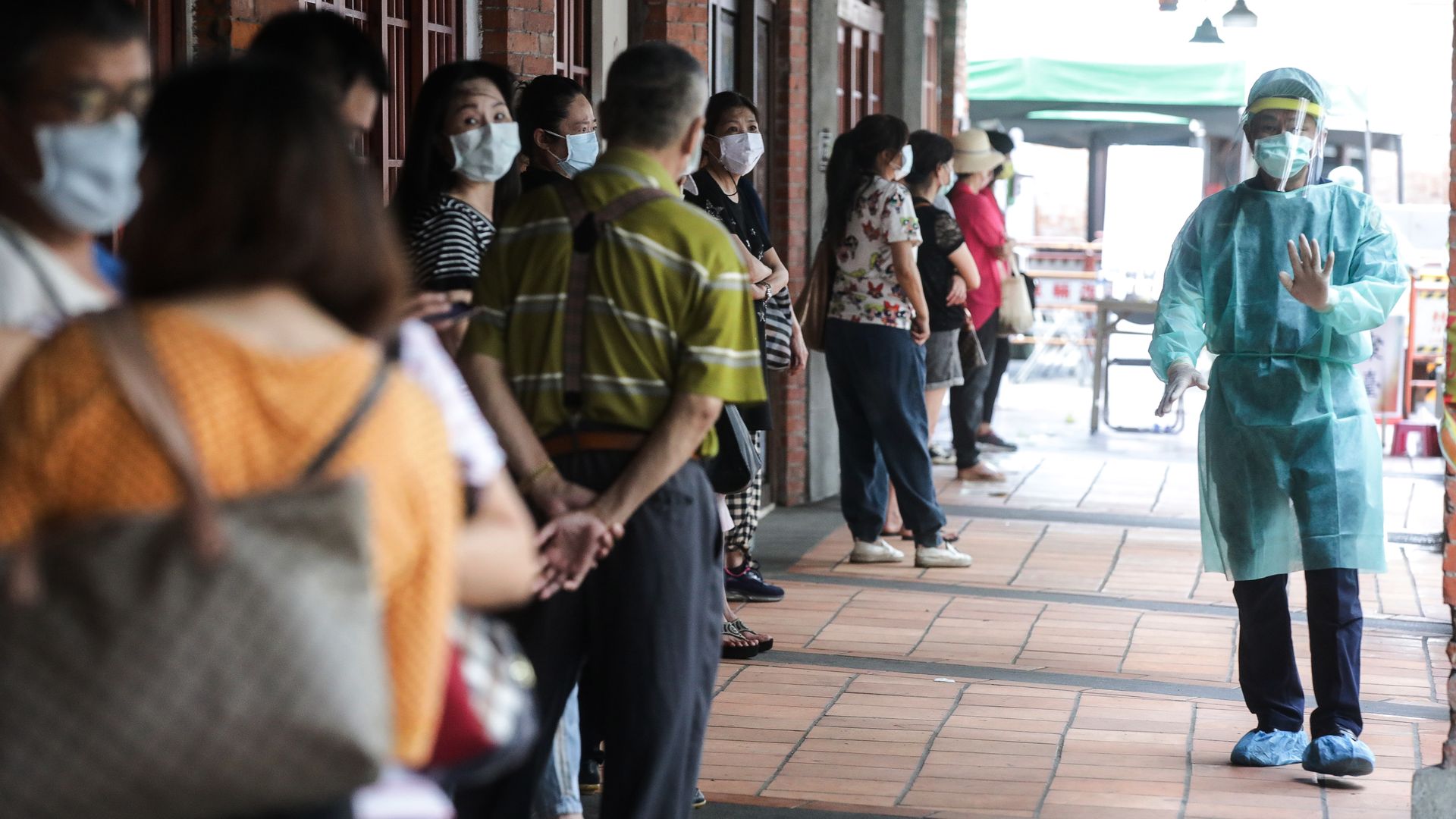 Picture of people waiting in line to get tested in Taiwan