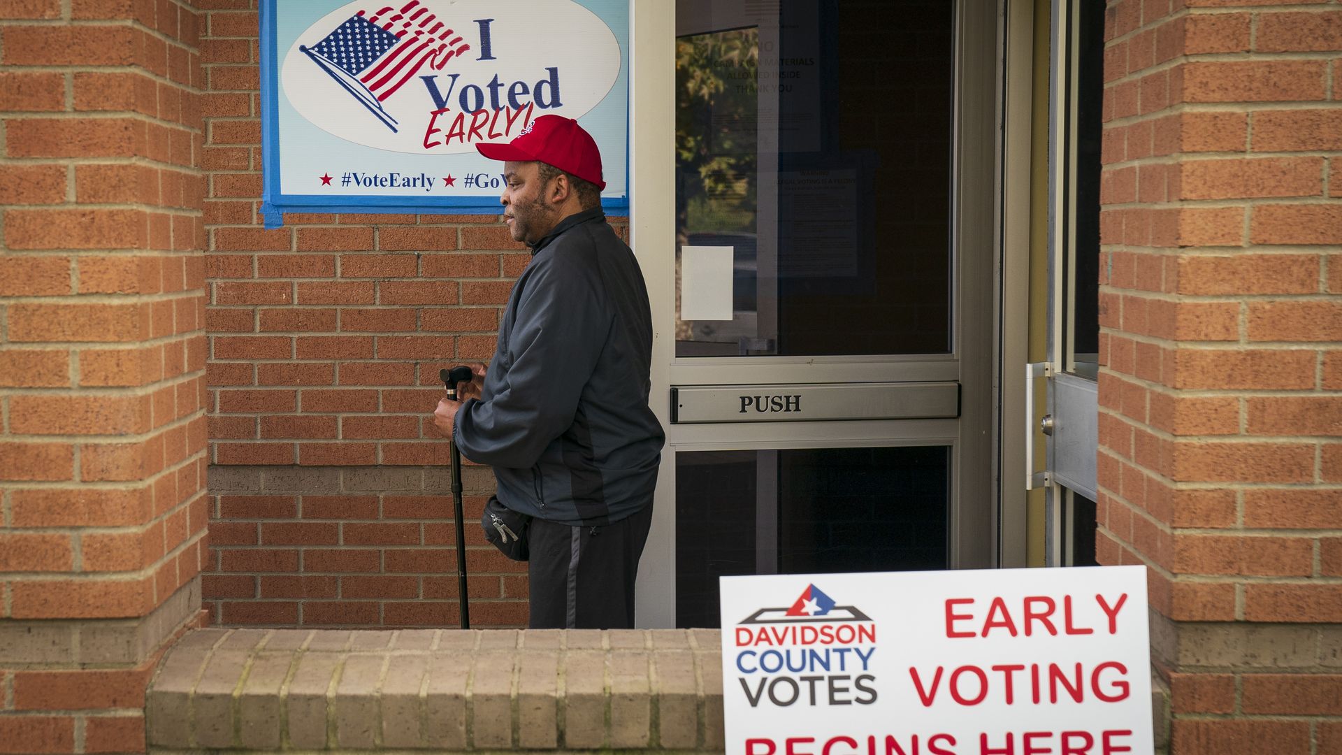 A man walks out of a voting place.