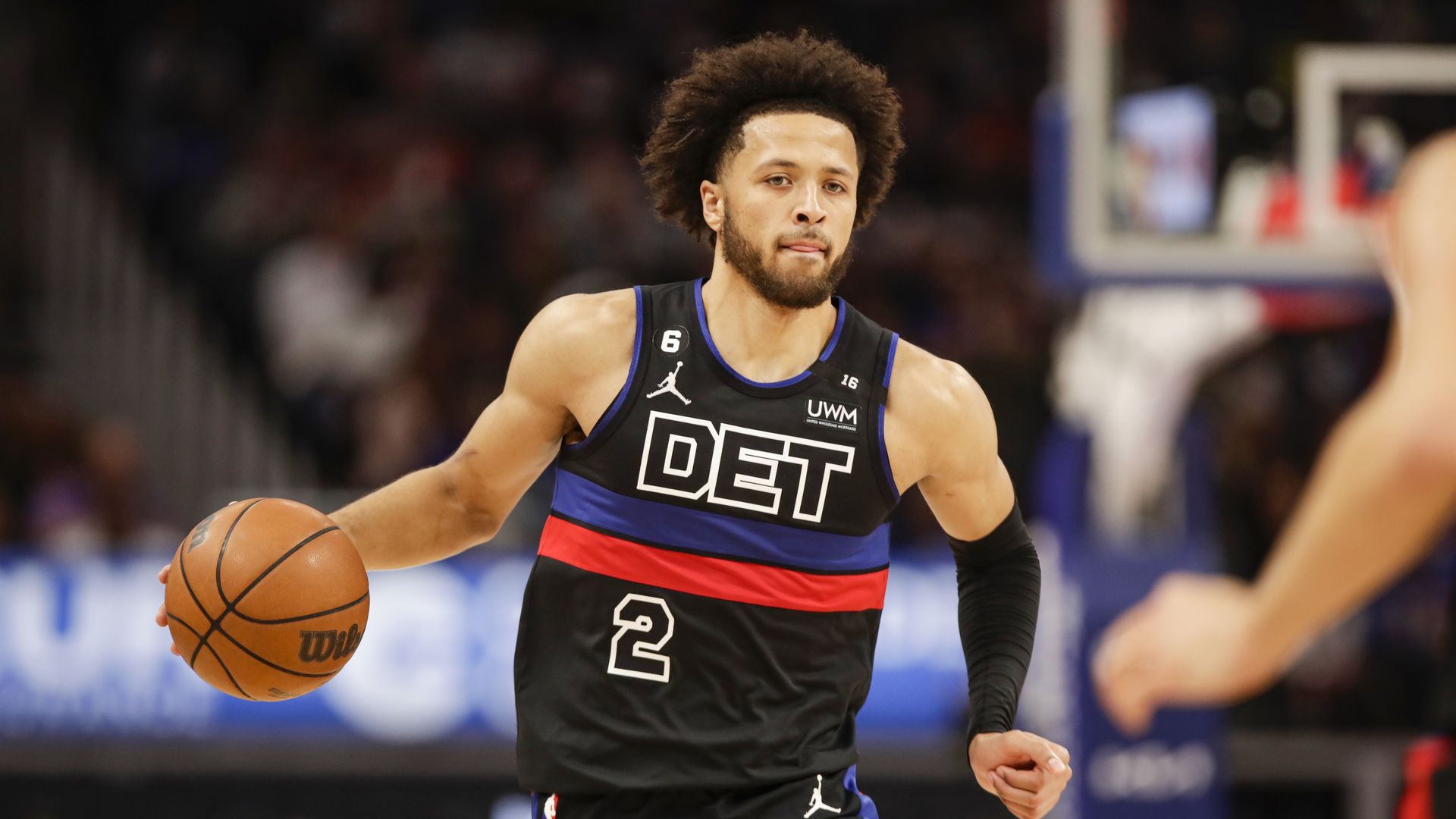 Cade Cunningham dribbles the ball