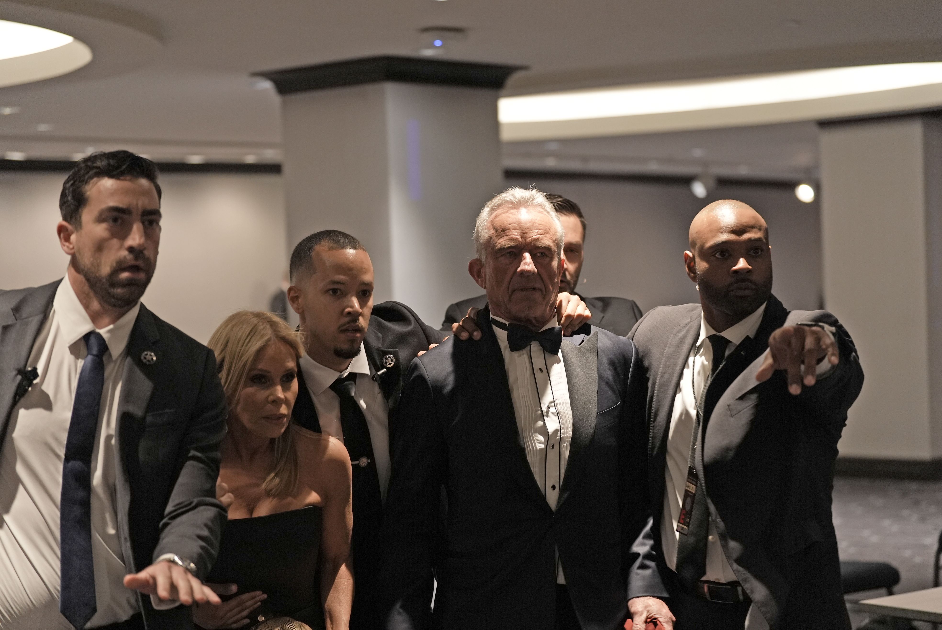 Health and Human Services Secretary Robert F. Kennedy Jr. and his wife, Cheryl Hines, are rushed out of the dinner. Photo: Salwan Georges/The New York Times