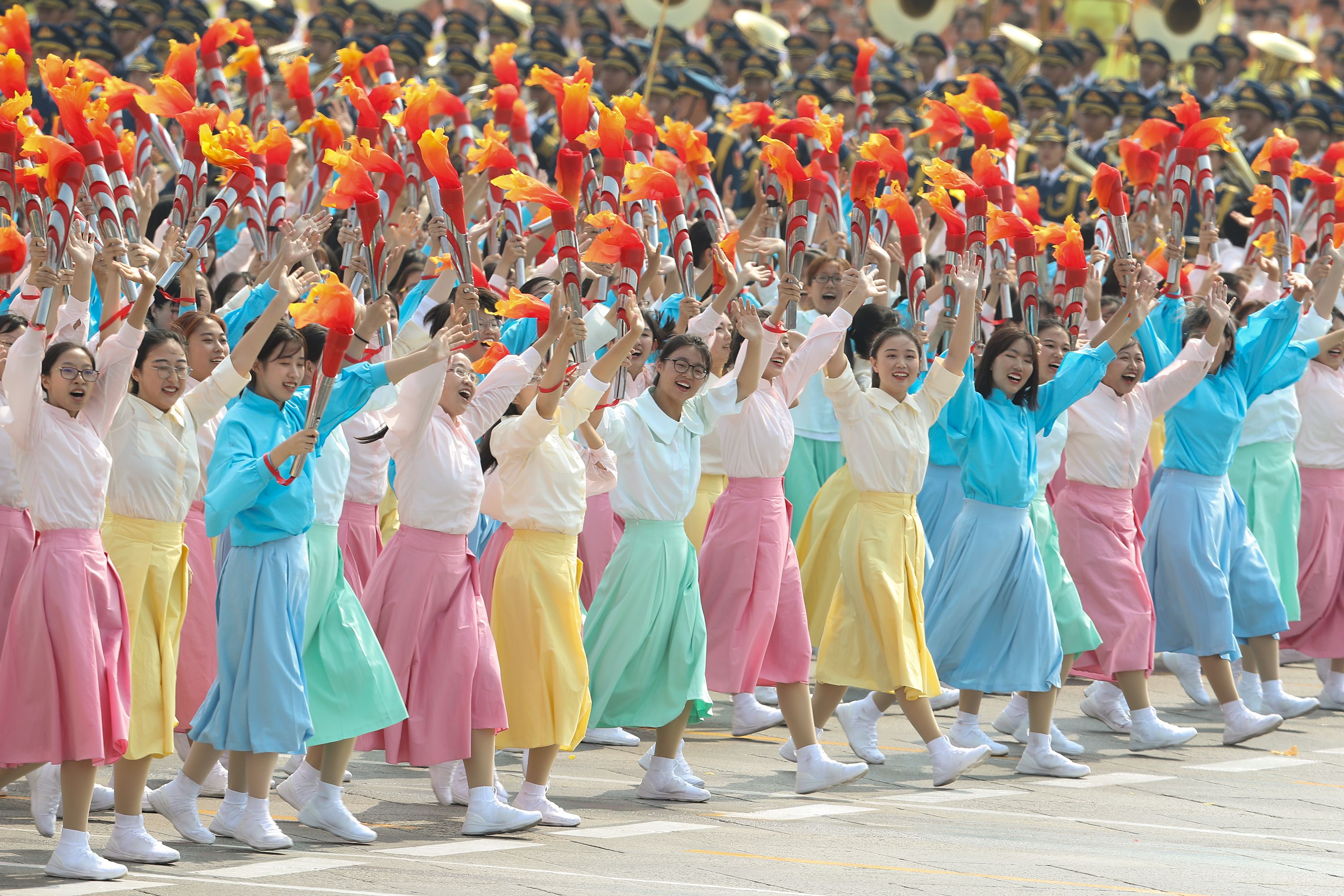  Performers walk and dance during the parade for the 70th anniversary of the establishment of the People's Republic of China on October 01