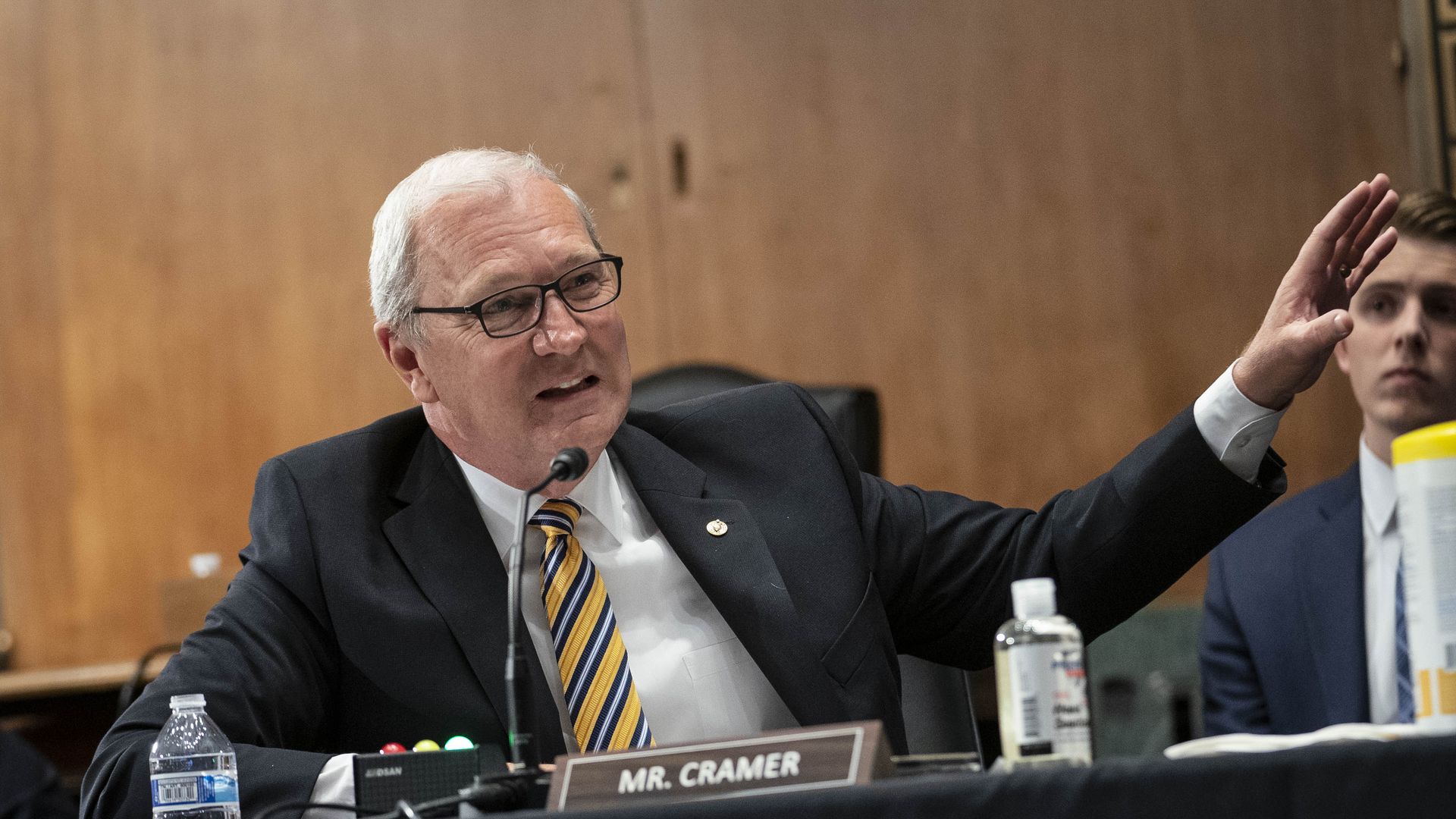 Photo of U.S. Senator Kevin Cramer in a suit, raising his left hand