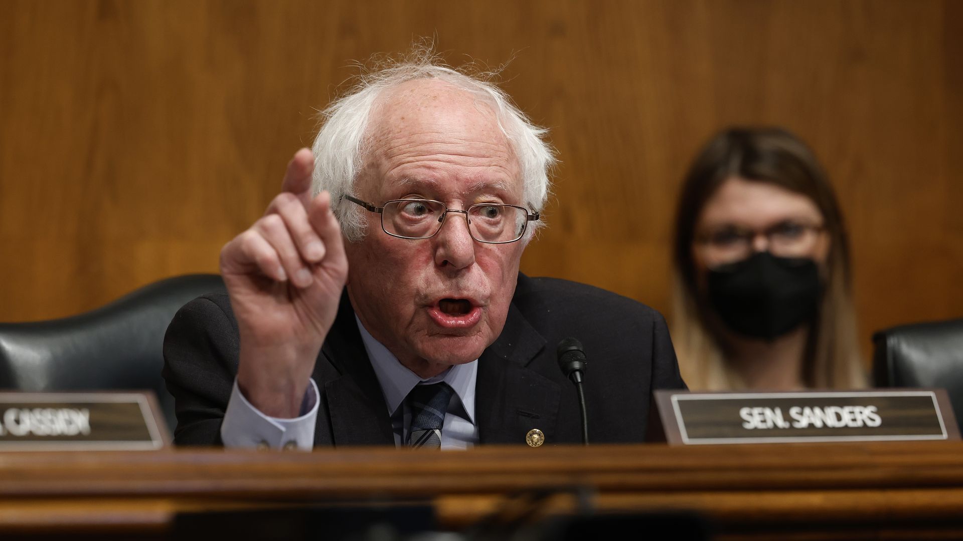 A photo of Bernie Sanders talking during a committee hearing