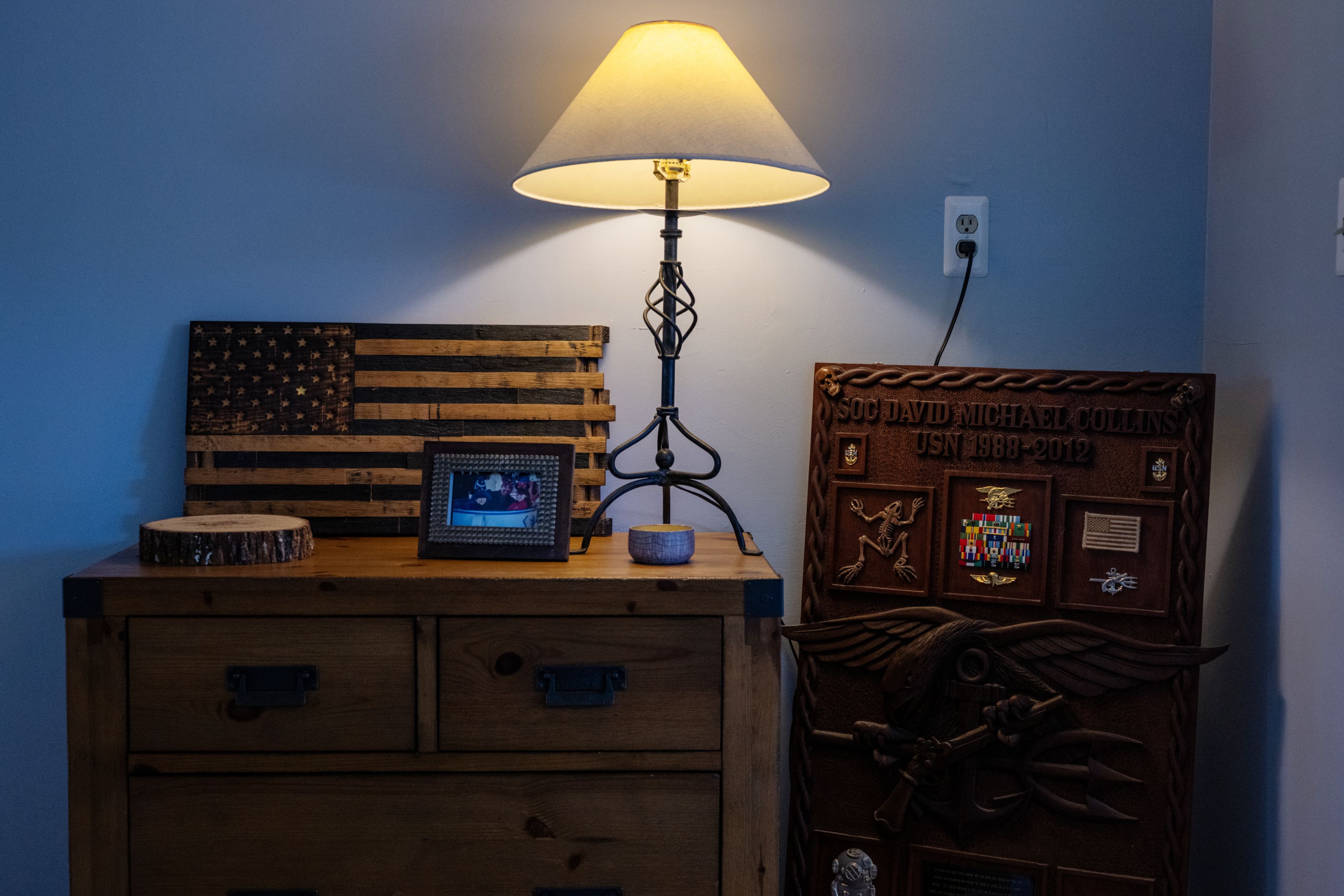 Items placed in memory of David Collins, a Navy SEAL for 20 years who took his own life in 2014 after a period — despite medical interventions — of growing memory, mood and mental function problems, at his wife Jennifer’s home in Virginia Beach, Va