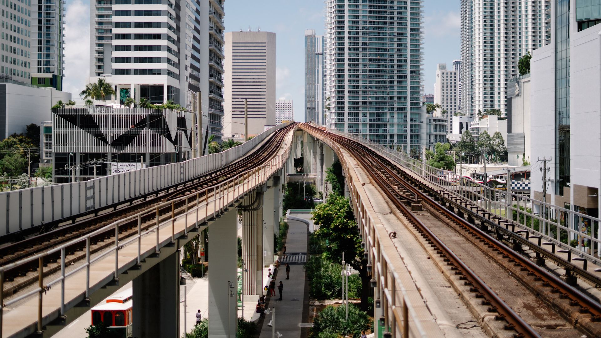 Miami-Dade County's metro rail with buildings in the background. 