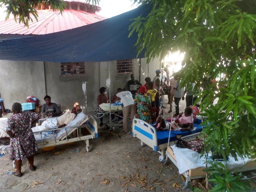 Injured people are treated in a field hospital after a 7.2 magnitude earthquake struck the country on August 14, 2021, in Jeremie, Haiti. 