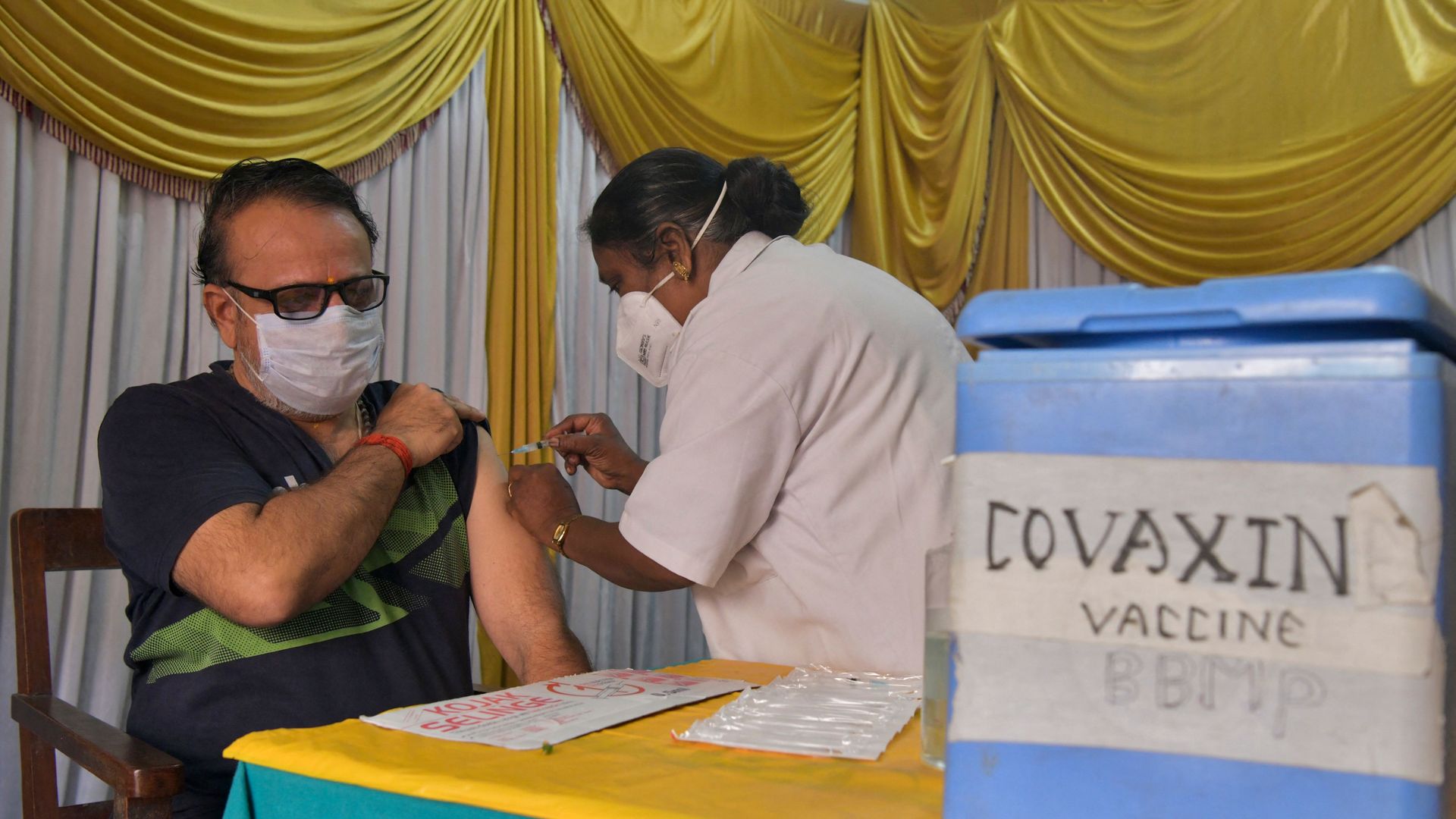 A health worker inoculates a man with a dose of Covaxin’s COVID-19 vaccine in Bangalore, India on June 9, 2021