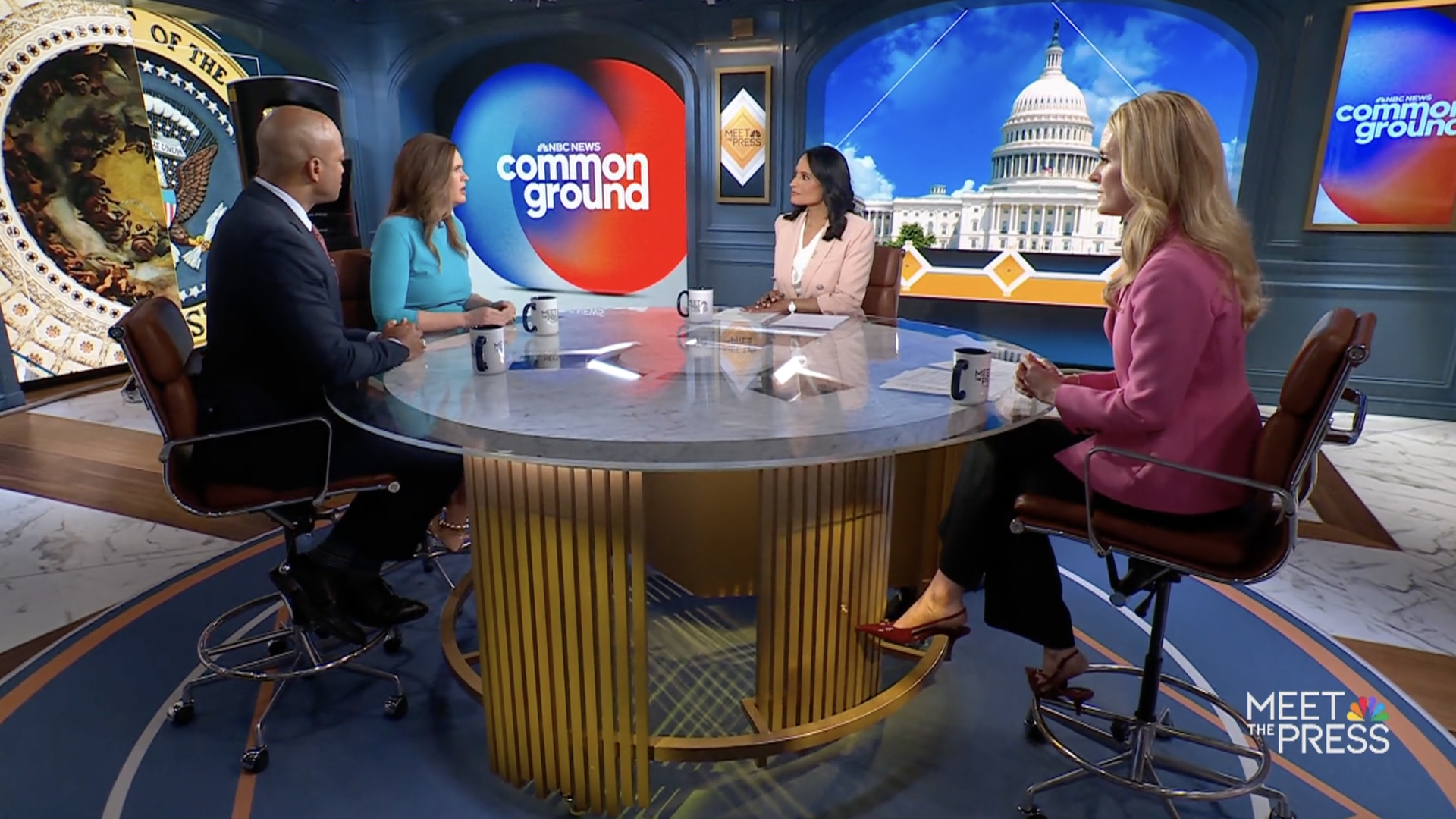 Four panelists sit around a round marble table on the NBC Meet the Press set; a blue-red "common ground" screen and the Capitol dome are visible behind them.