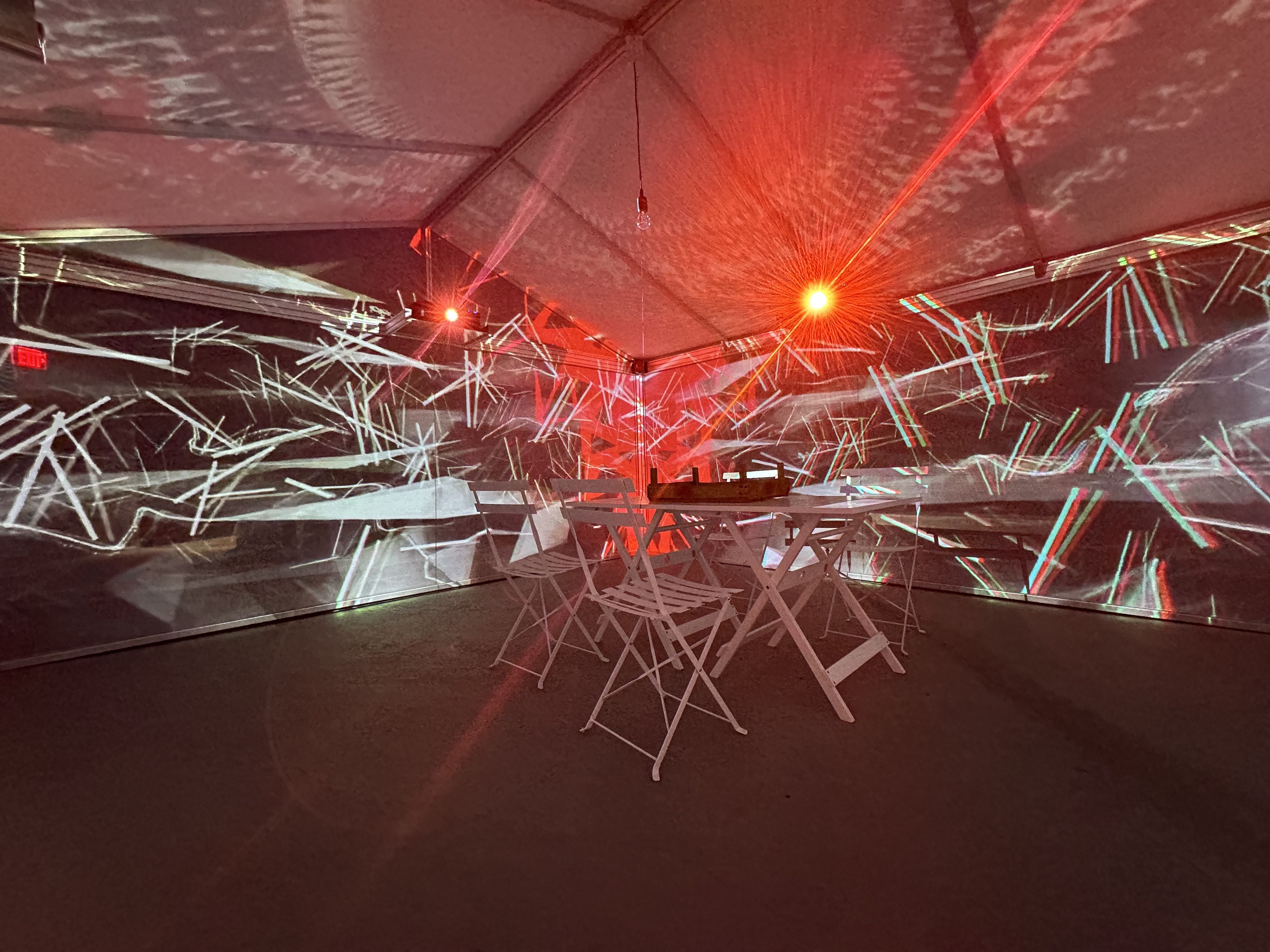 A light and sound show inside a fabric greenhouse recreating Scottish artist Leigh Sachwitz's memory of her grandmmother's garden shed during a storm. Seen in the WNDR Museum in Boston.