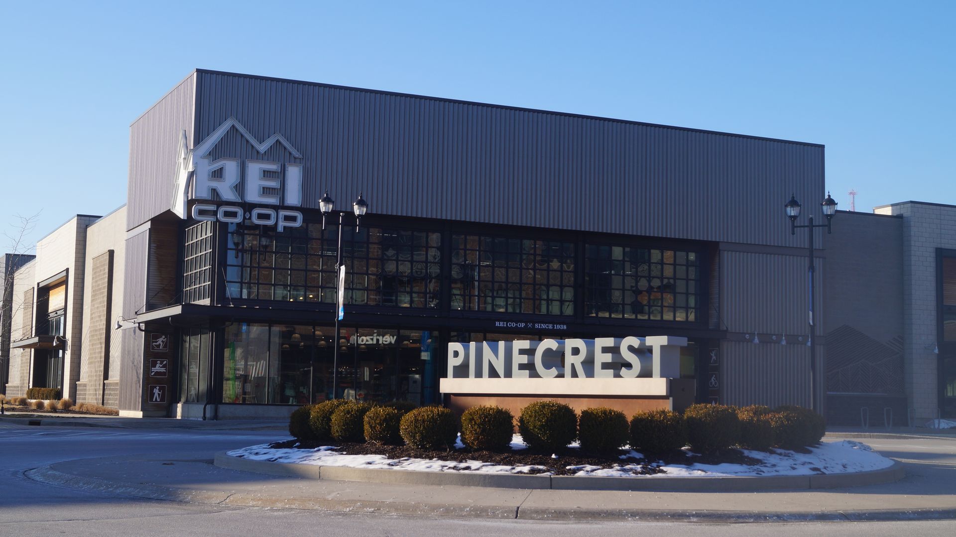 Exterior of REI Co-op in Beachwood, Ohio with Pinecrest sign in the foreground