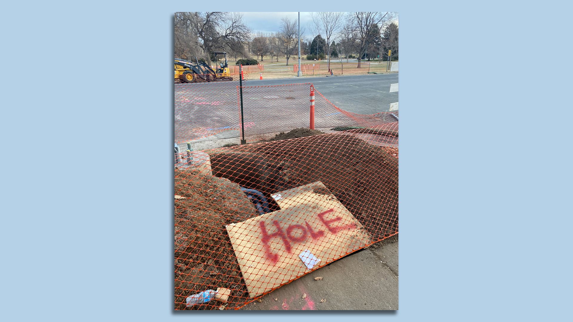 A sign that says "hole" on a construction site in Denver.