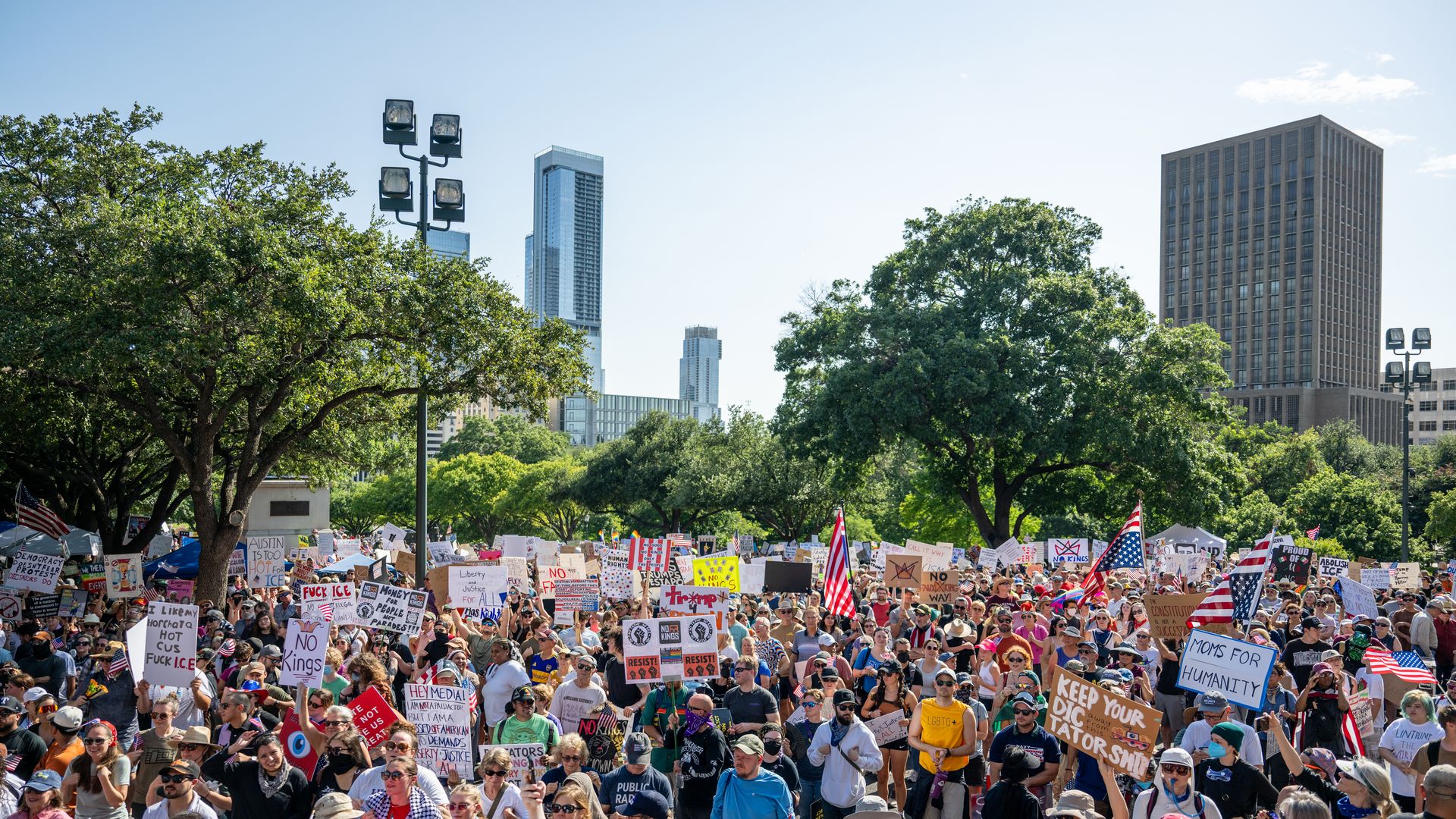   People rally during the "No Kings Day" demonstration at the Texas State Capitol on June 14, 2025 in Austin, Texas. 