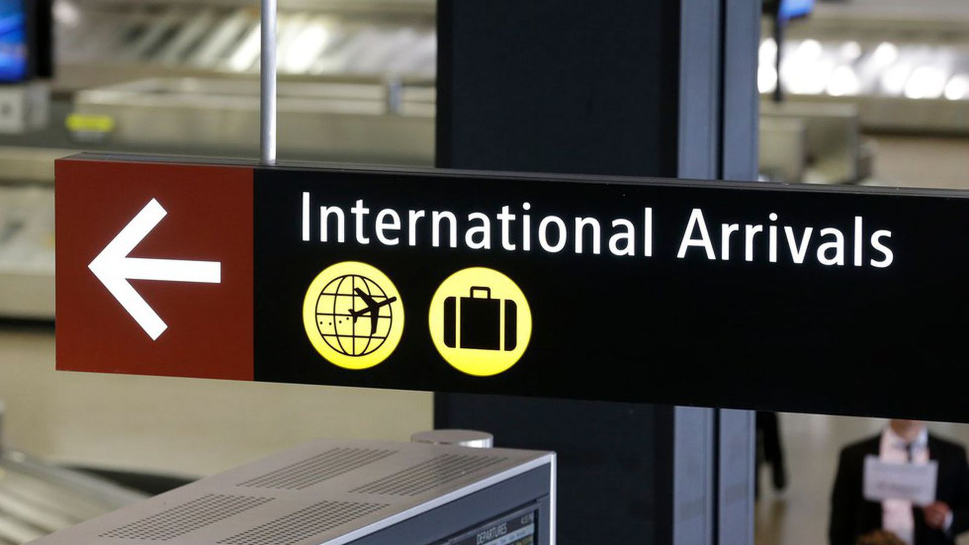 A sign for International Arrivals is shown at the Seattle-Tacoma International Airport.
