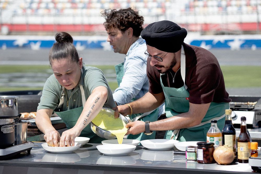 three chefs compete outside on a motor speedway