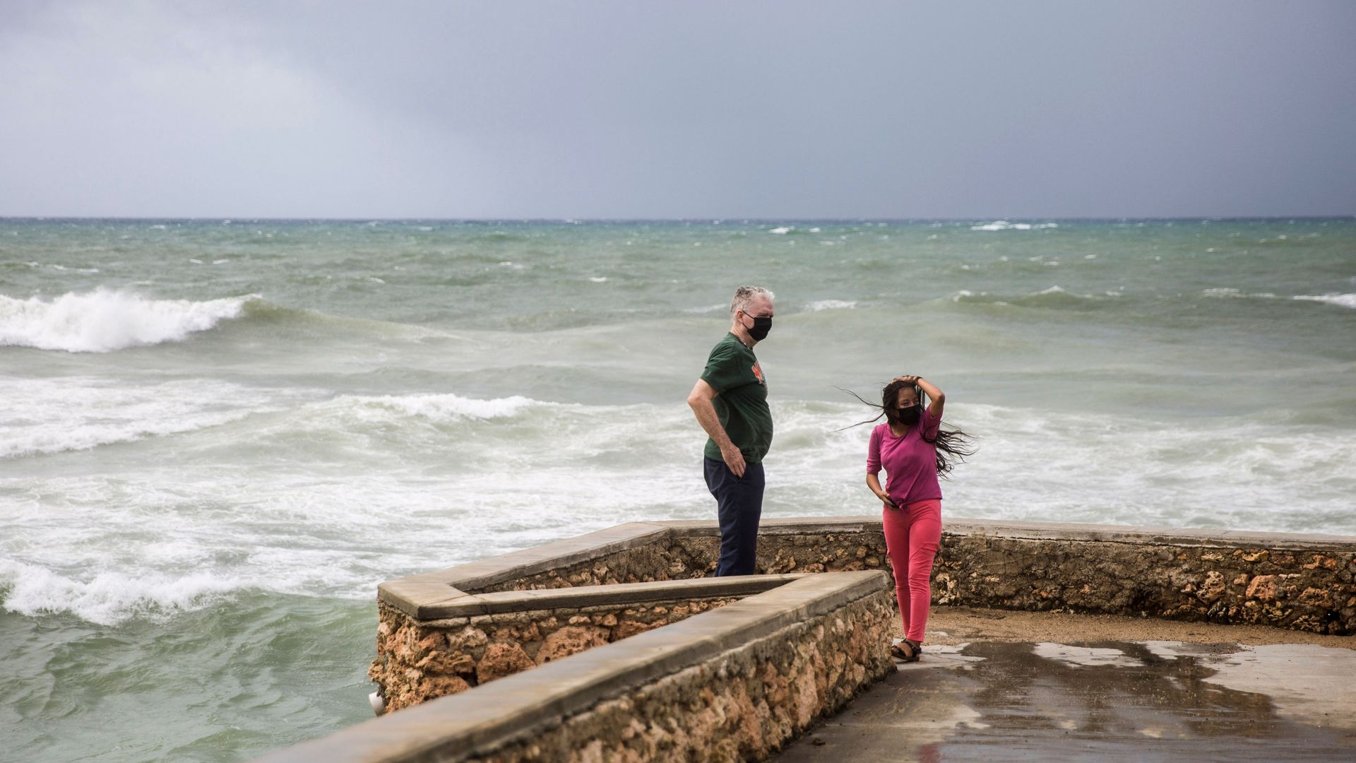 People watches the strong waves during the passage of storm Elsa at the Malecón in Santo Domingo, on July 3