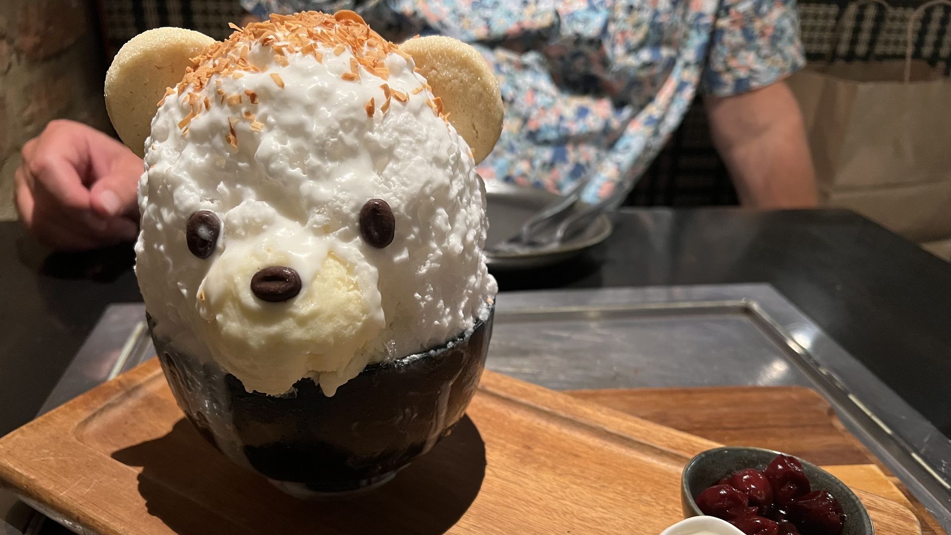 Photo of a dessert shaped like a teddy bear head. 