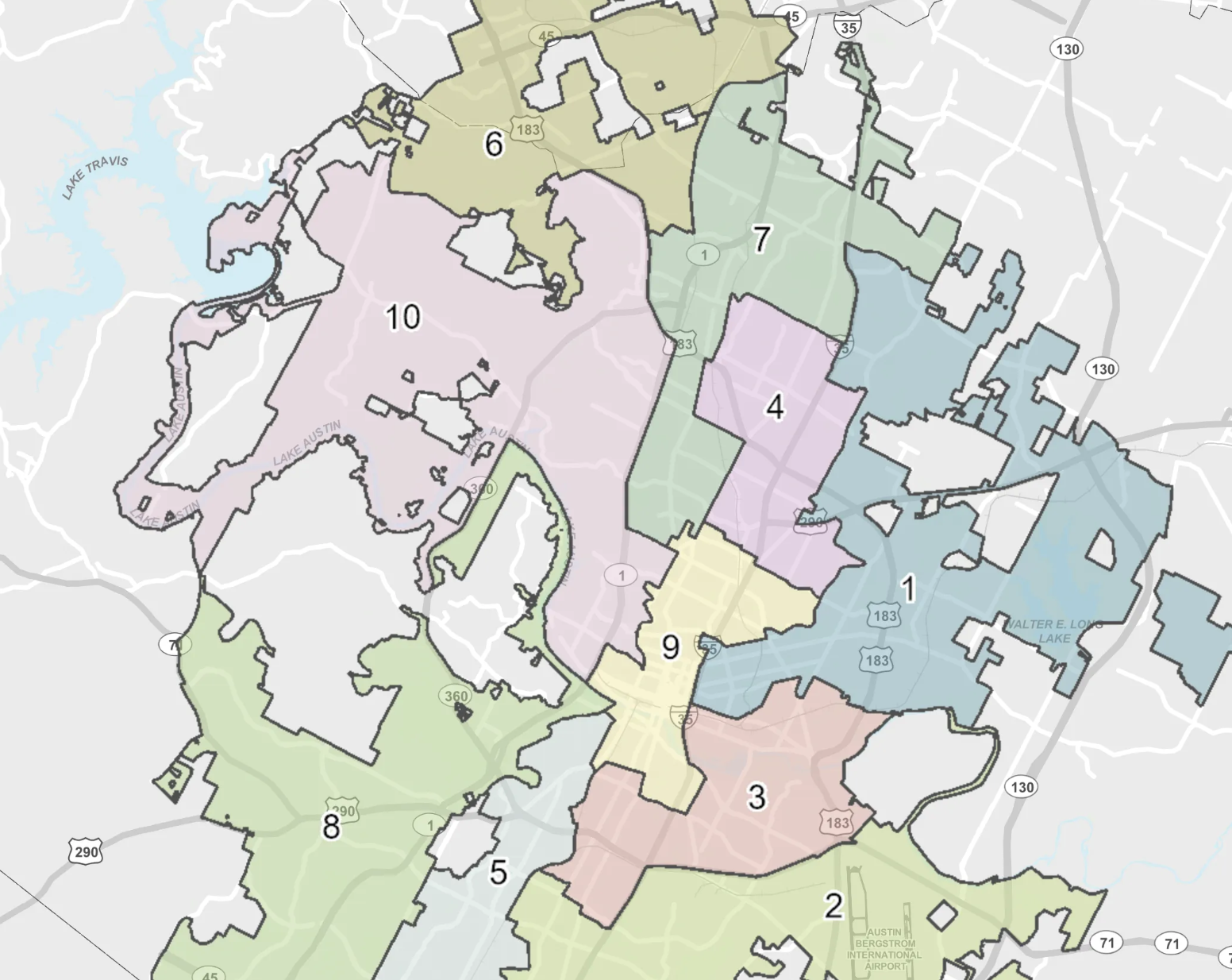 Colorful map of a Texas city with multiple color-coded districts labeled 1–10. Regions are pink, green, yellow, blue, purple; major roads visible and Lake Travis on the left.