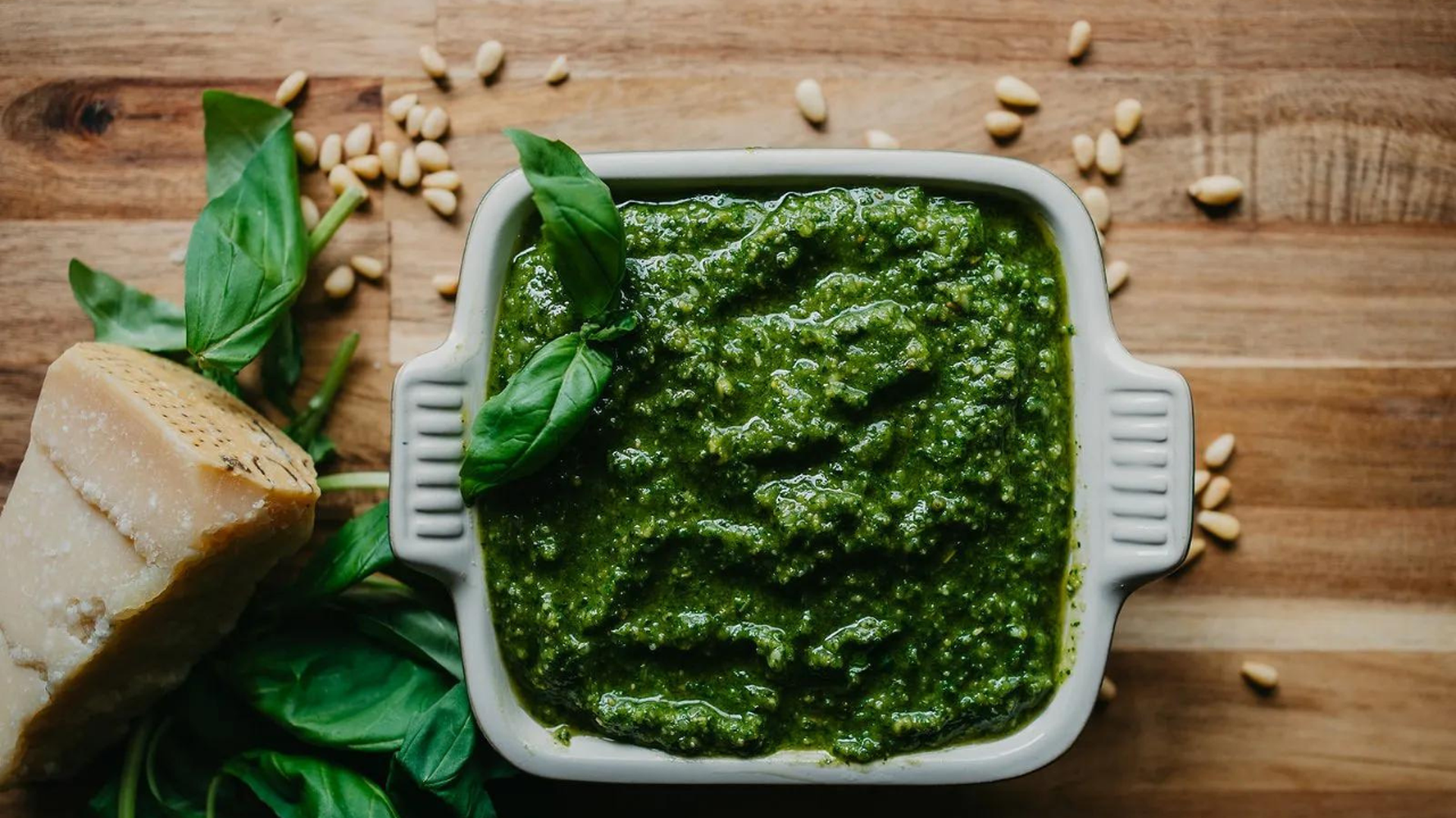 pesto surrounded by parm cheese and pine nuts