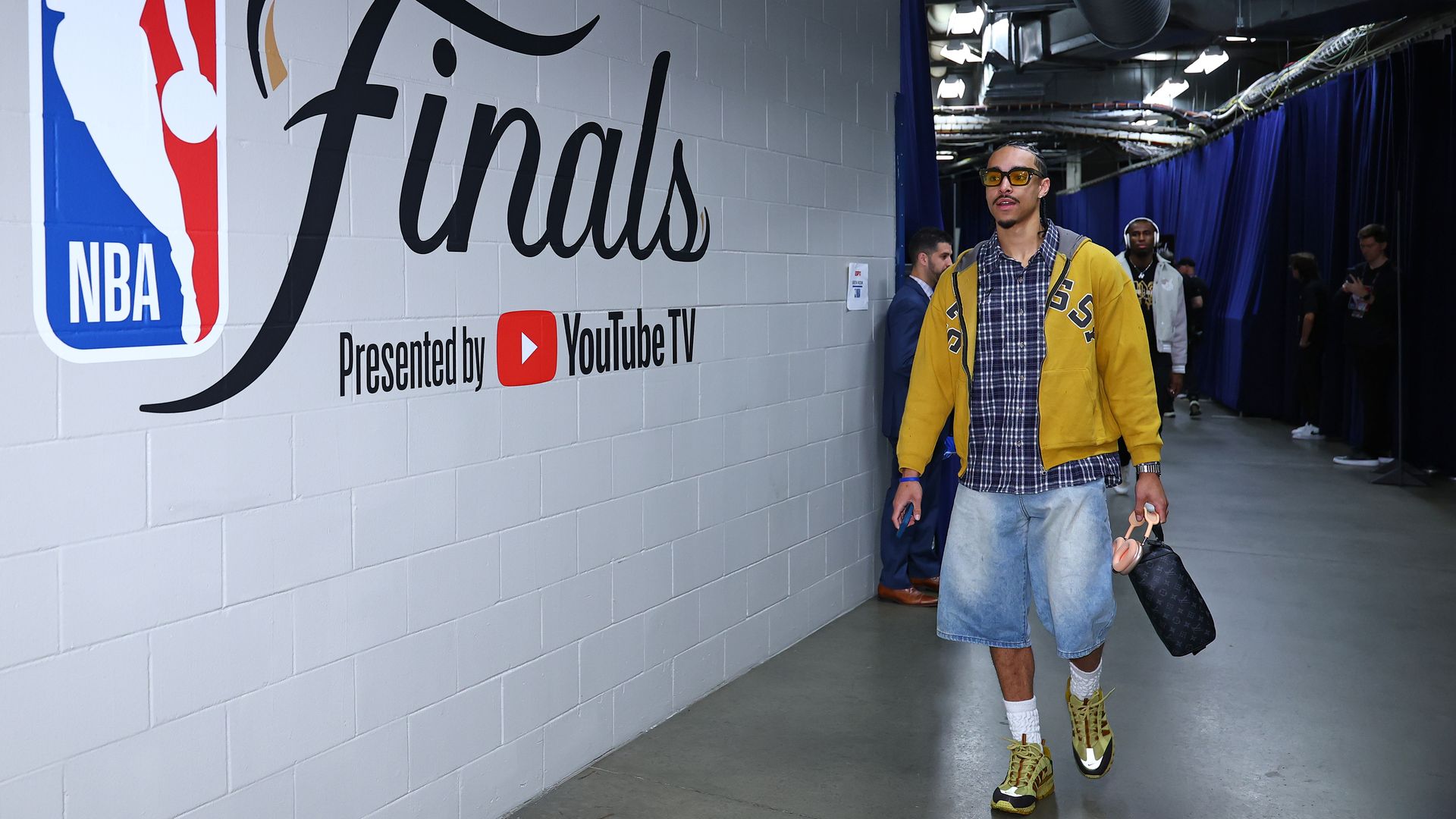 A guy walking down a hallway