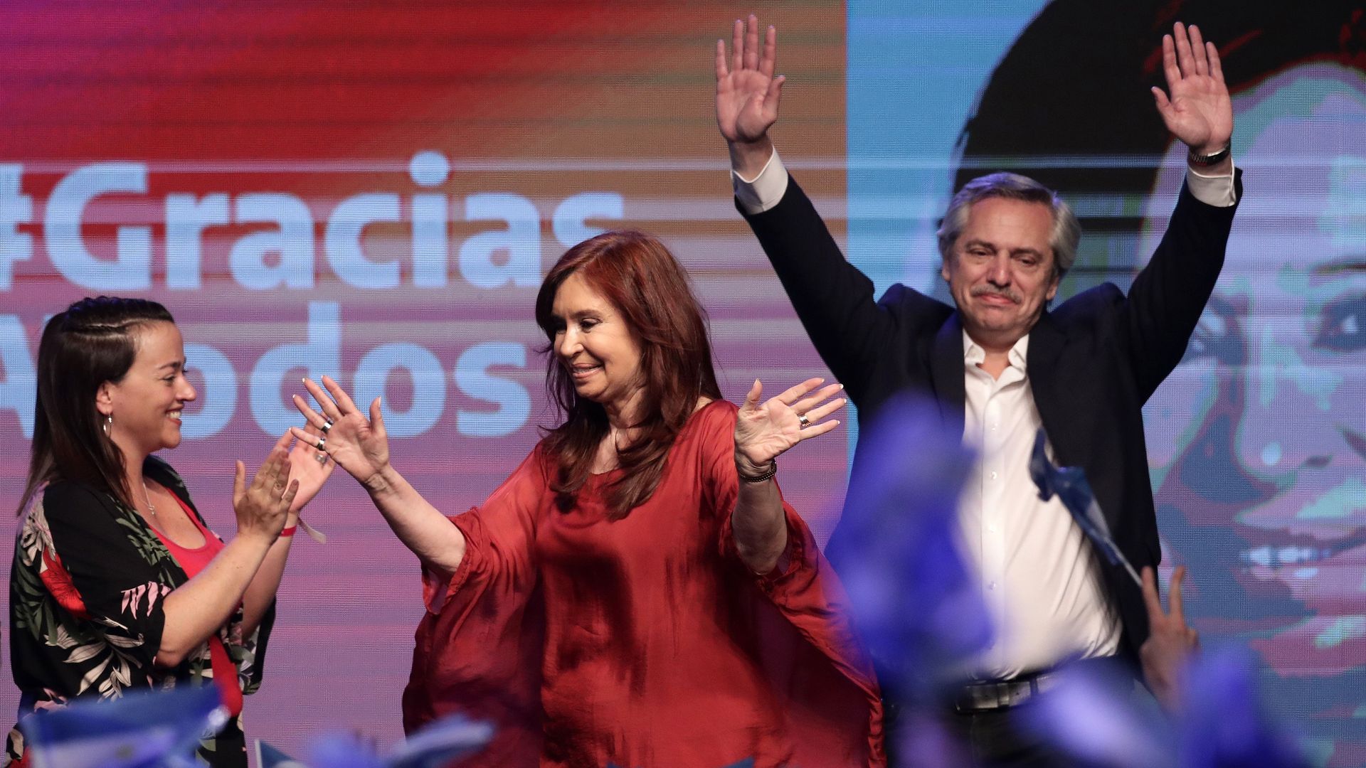 Alberto Fernandez and Cristina Fernandez de Kirchner on stage celebrating victory