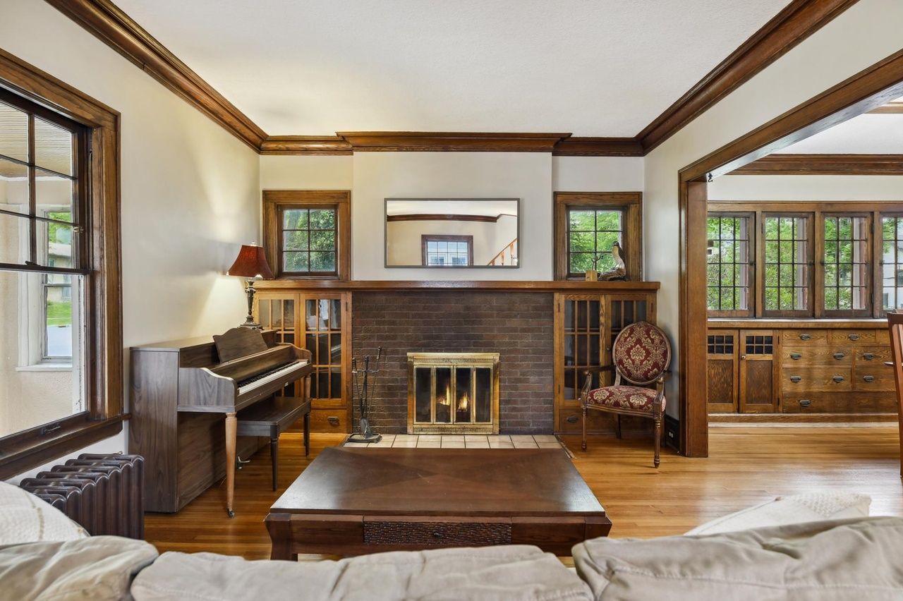 classic living room with fireplace and wood paneling