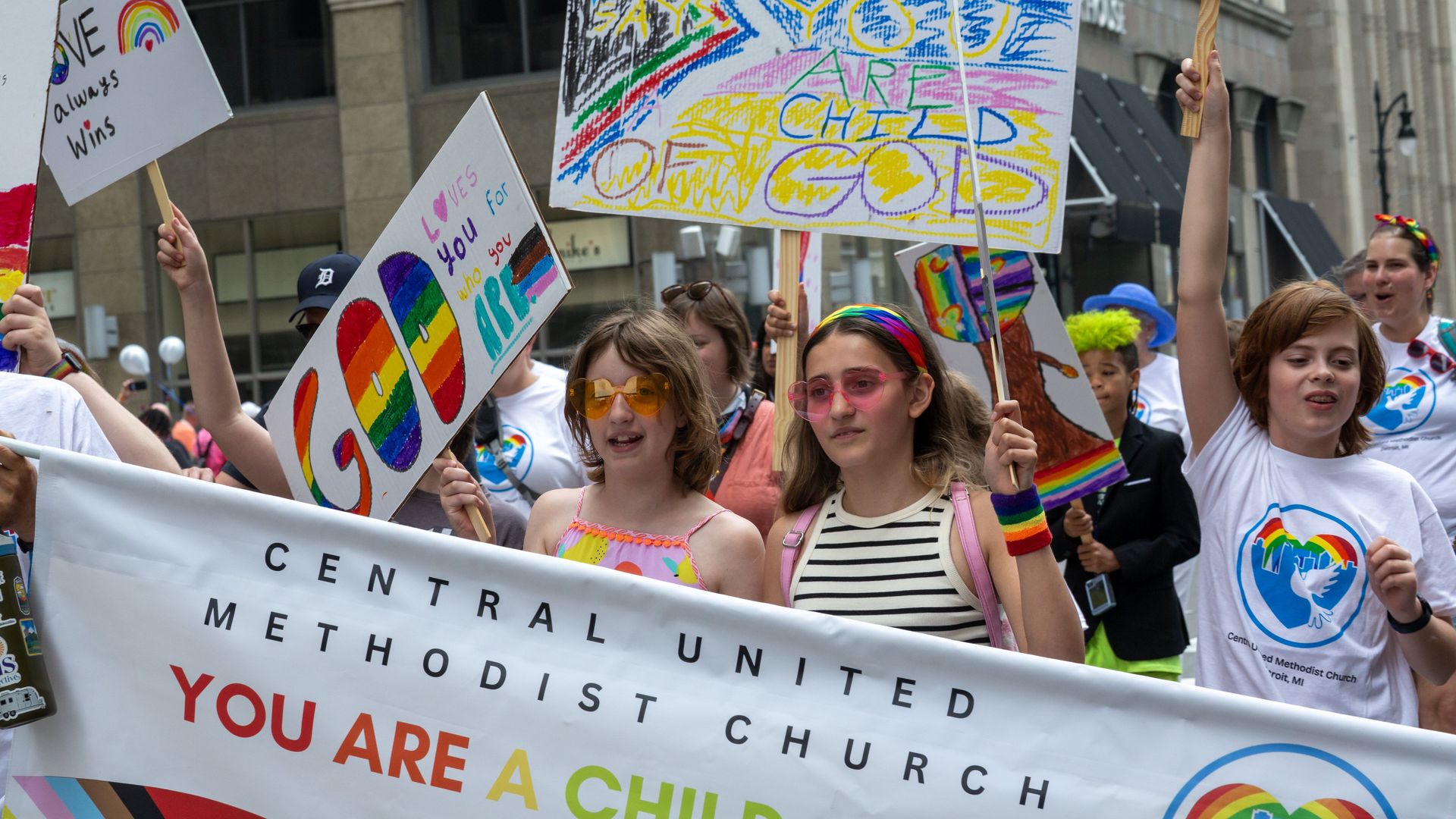 Young people marching in a pride parade