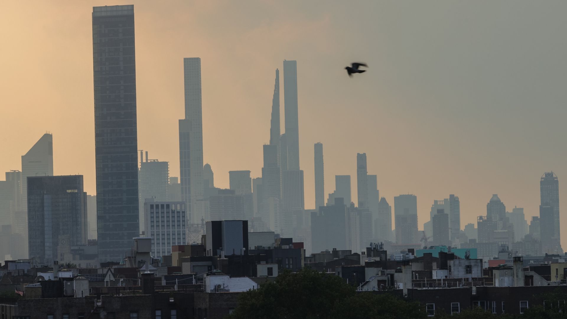 The New York City skyline against a haze of wildfire smoke.