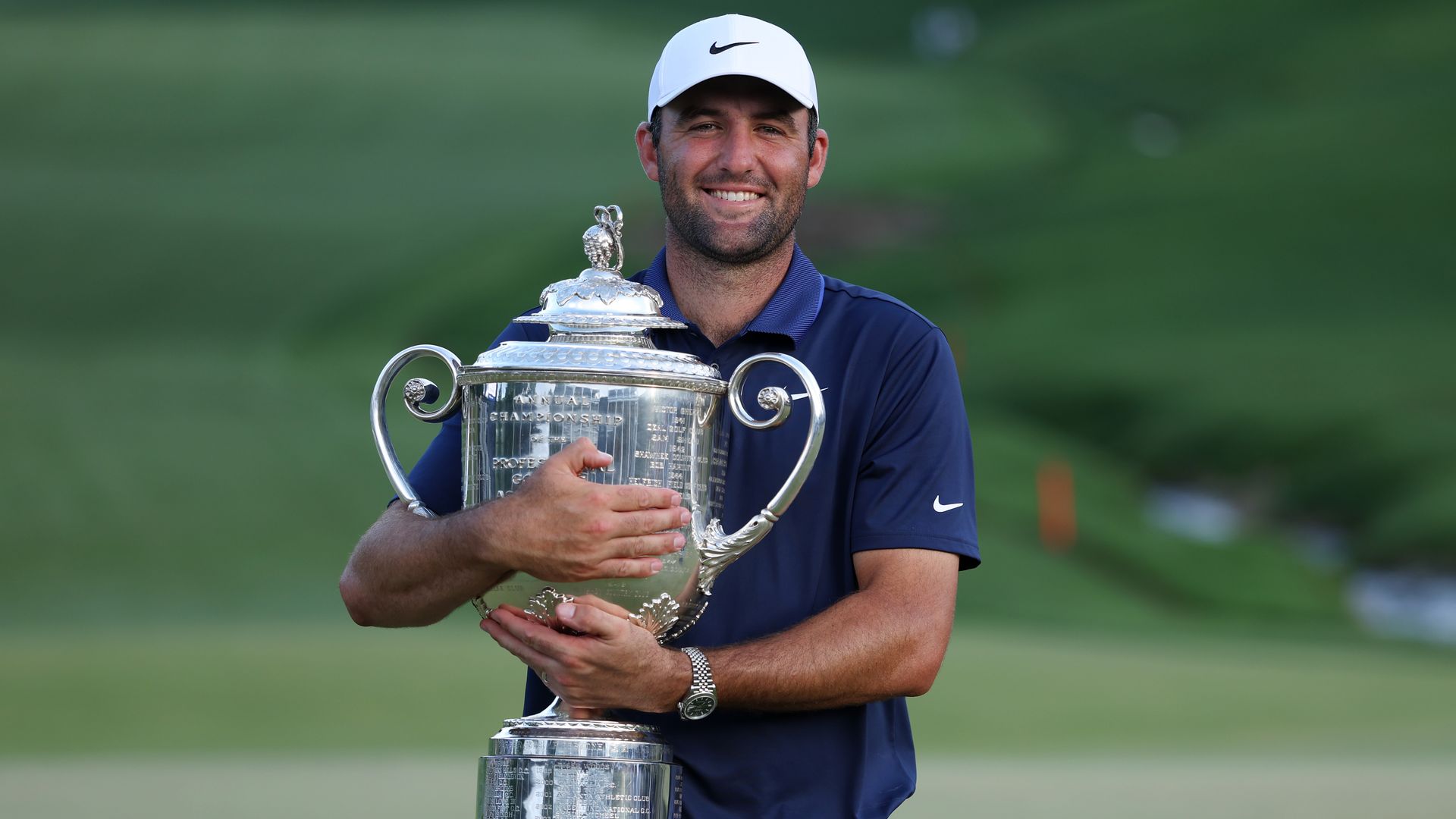 Scottie Scheffler holding the PGA Championship Trophy in Charlotte.