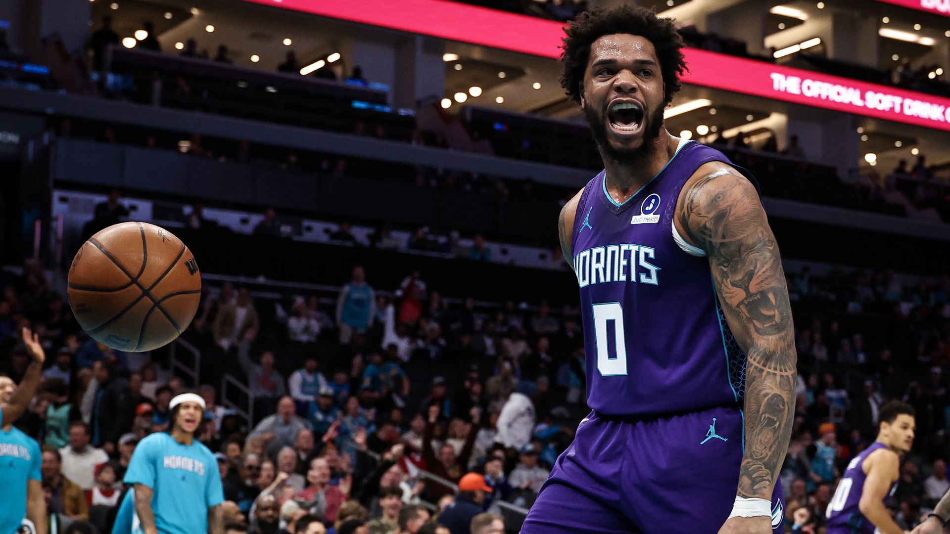 Miles Bridges #0 of the Charlotte Hornets reacts after dunking the ball during the first half of a basketball game against the Philadelphia 76ers at Spectrum Center on January 26, 2026 in Charlotte, North Carolina.