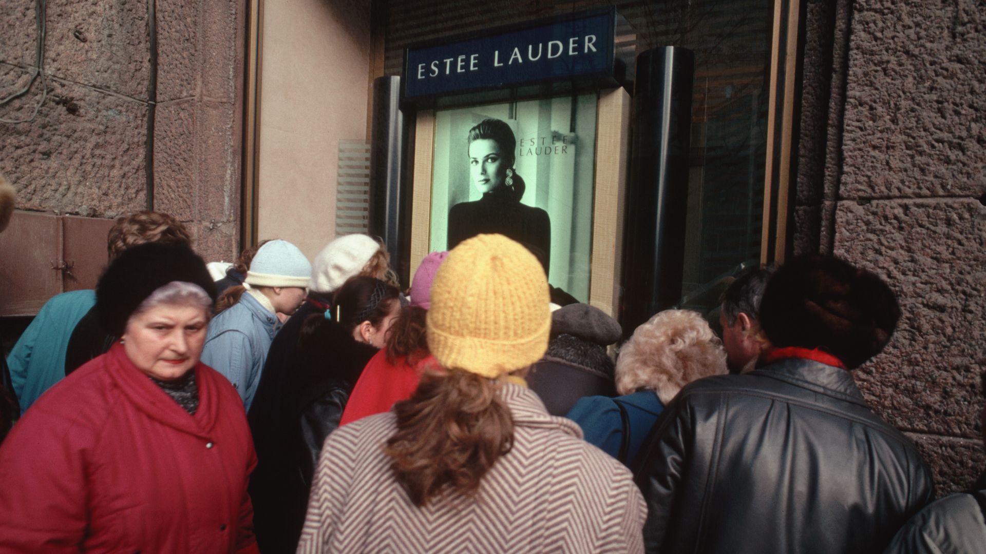 A crowd of Soviet women gathers at the window display of an Estee Lauder store in Moscow. Paulina Porizkova, an Estee Lauder model, is pictured on the advertising poster in 1989.