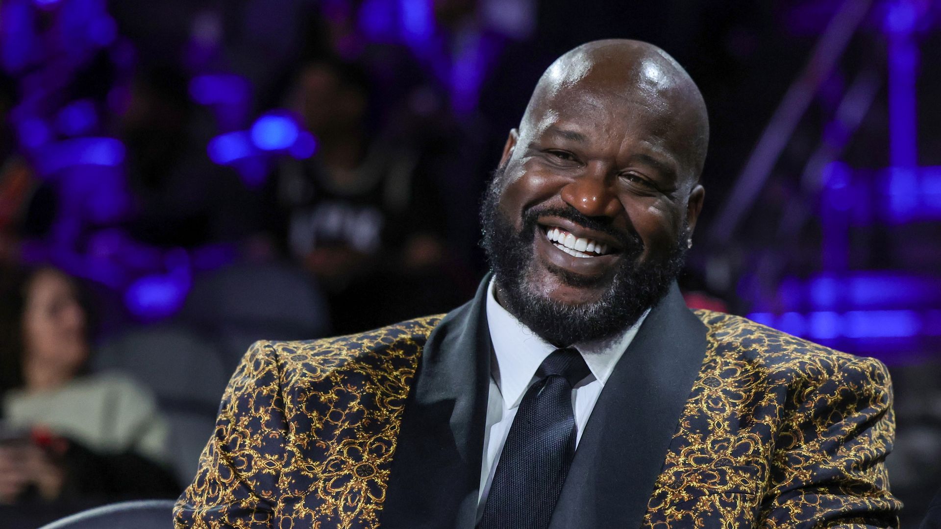 Photo shows Shaq smiling.