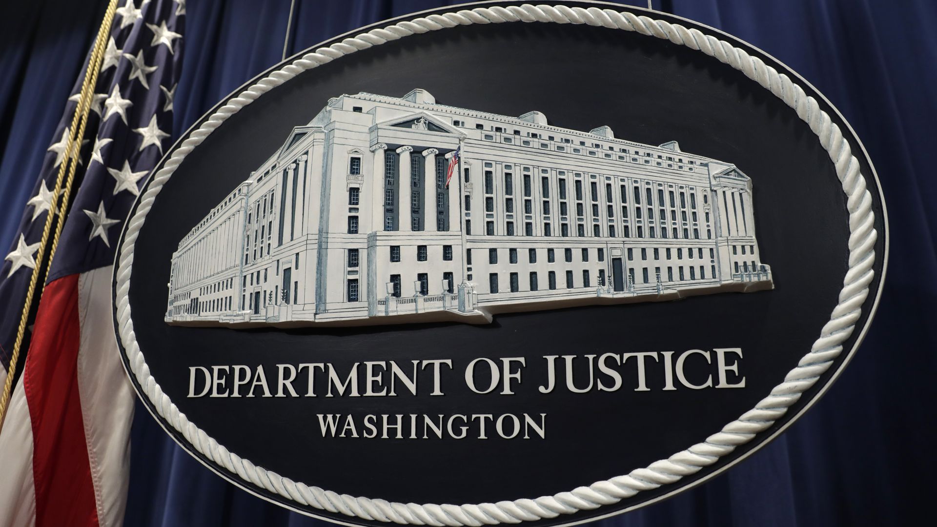 The U.S. Department of Justice seal is displayed following a news conference with Rod Rosenstein, deputy attorney general, not pictured, in Washington, D.C., U.S. on Thursday, Dec. 20, 2018