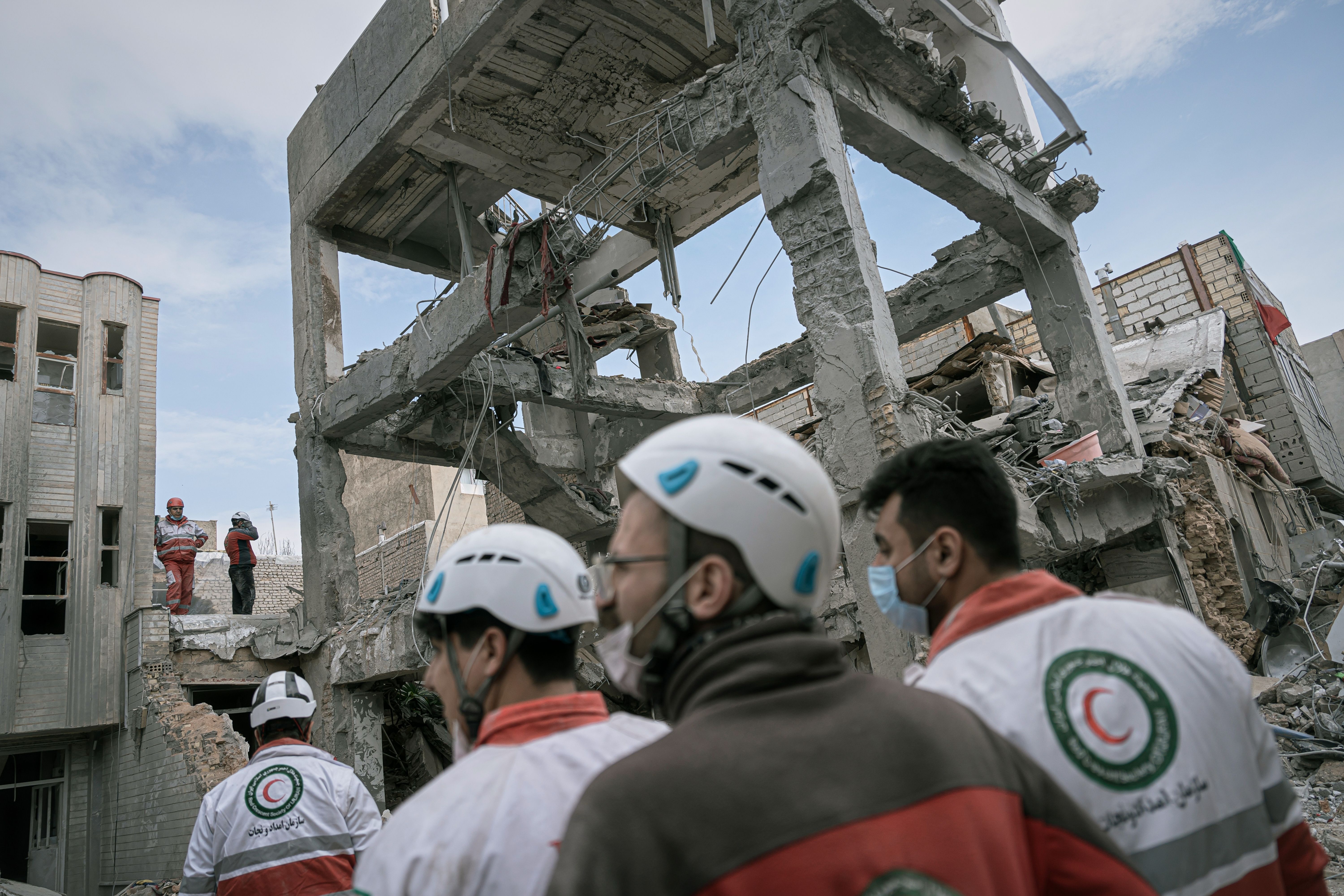 First responders inspect the remains of a residential building hit in an overnight strike in Tabriz, Iran, on Tuesday. AP Photo/Matin Hashemi