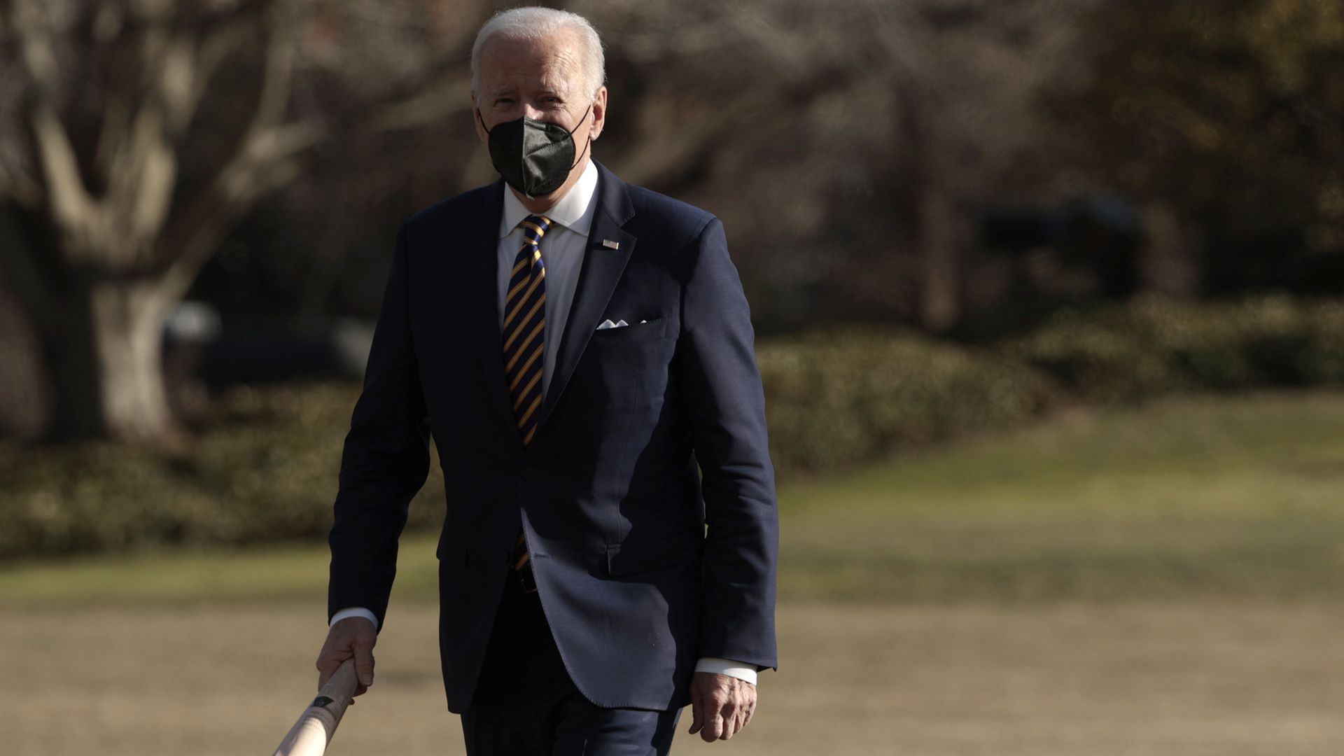 President Biden walking across the South Lawn of the White House on Feb. 10.