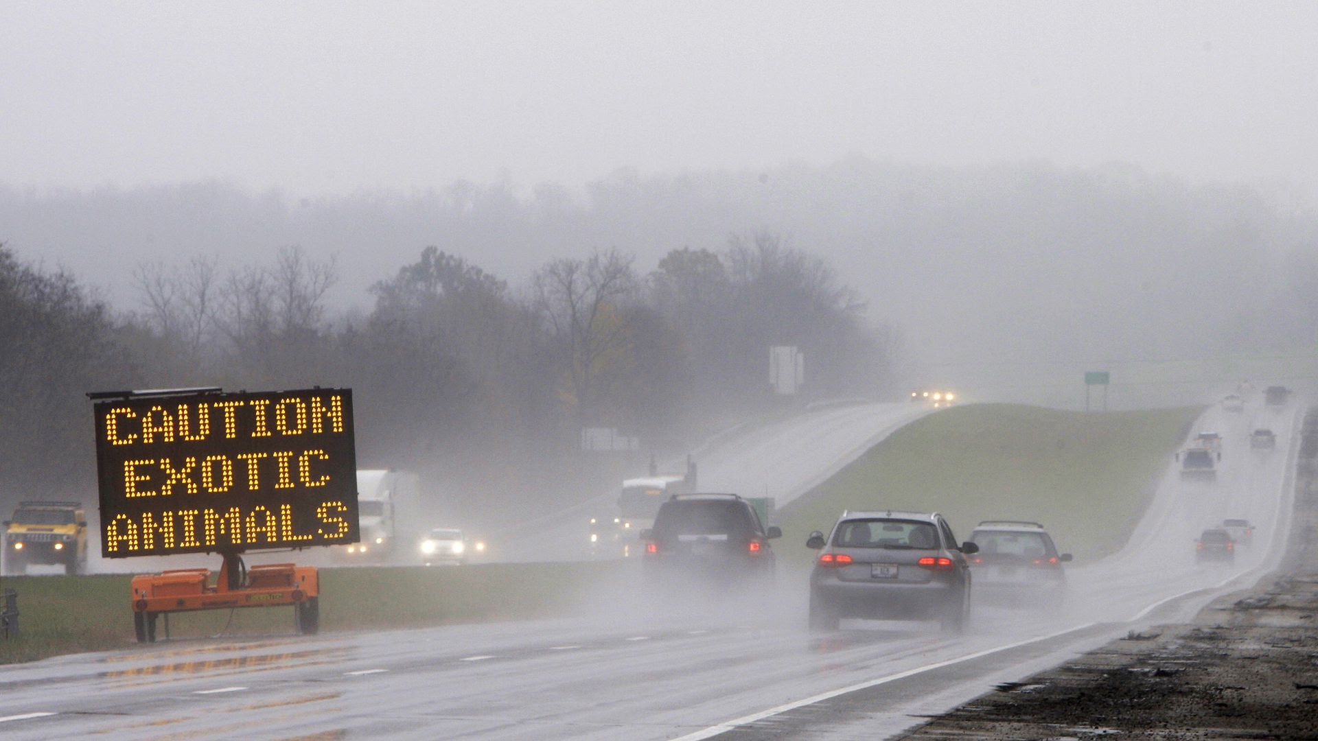 A sign warns passing motorists about exotic animals on the loose from a wildlife preserve in Zanesville. 