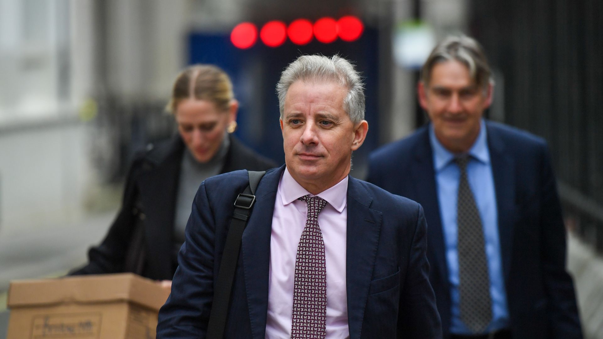 Christopher Steele, ex-MI6 agent, centre, departs from the Royal Courts of Justice in London, UK, on Monday, Oct. 16, 2023. 