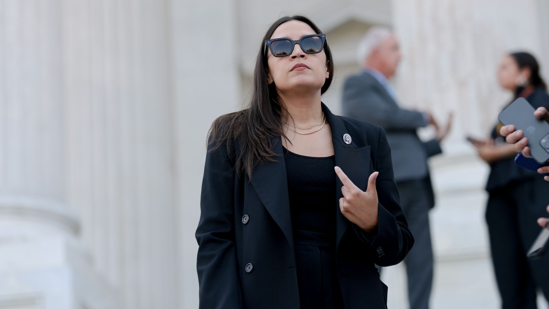 Rep. Alexandria Ocasio-Cortez speaks to reporters outside the U.S. Capitol in Washington, D.C.