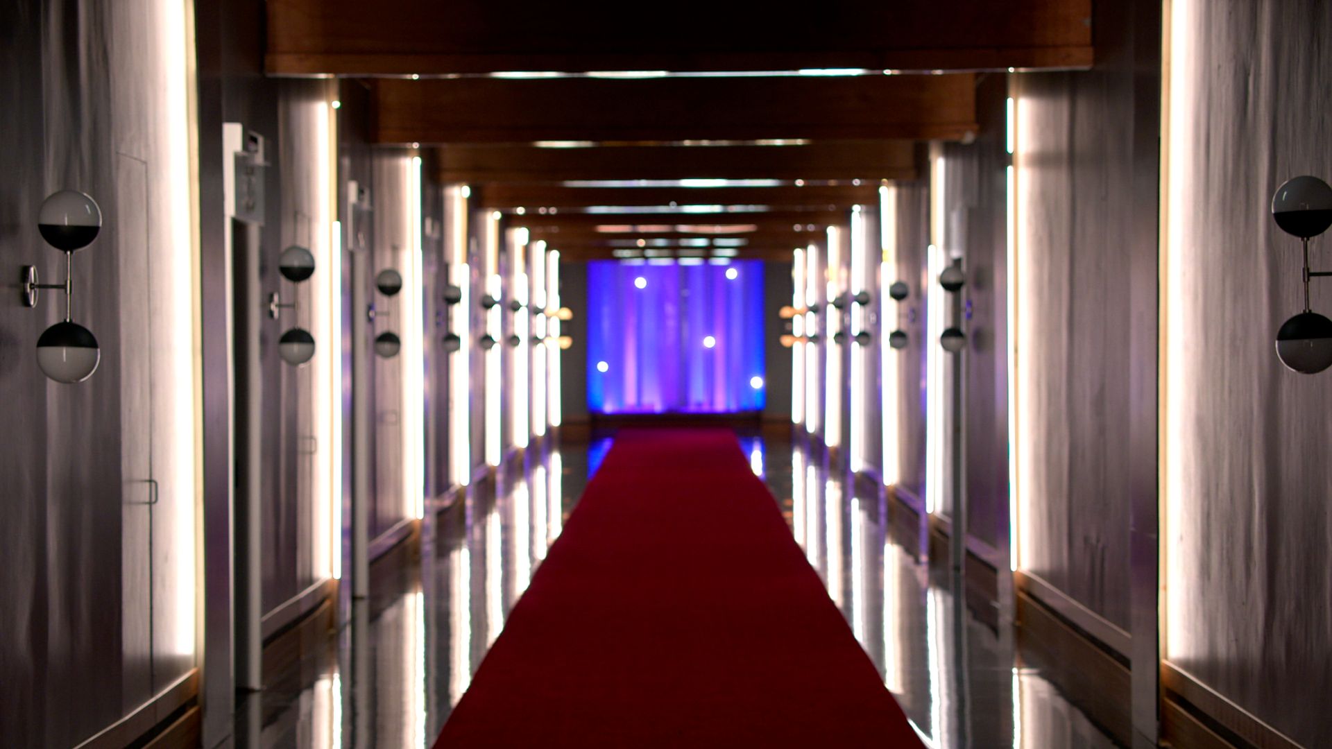 A photo depicting a hallway lined with the pods from the Netflix show "Love Is Blind."