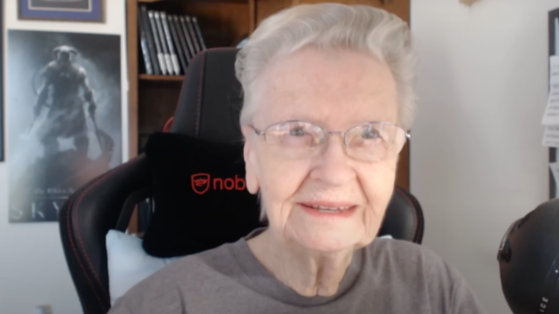 "Skyrim Grandma" Shirley Curry sits in her gaming chair in front of a Skyrim poster