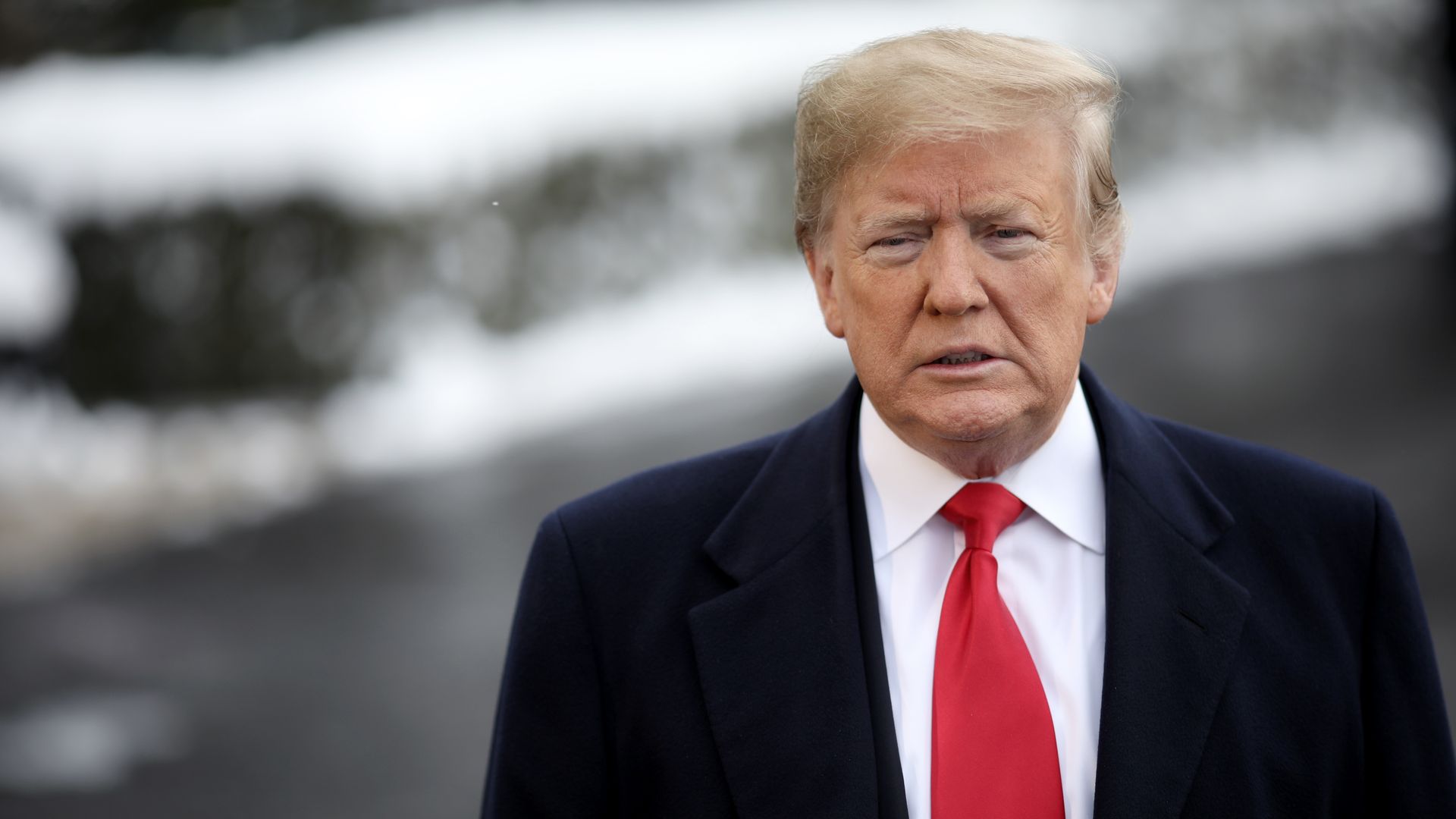 President Donald Trump answers questions from the press as he departs the White House.