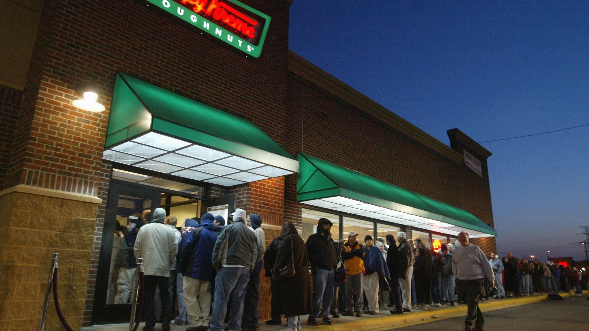 People lined up outside of Krispy Kreme store 