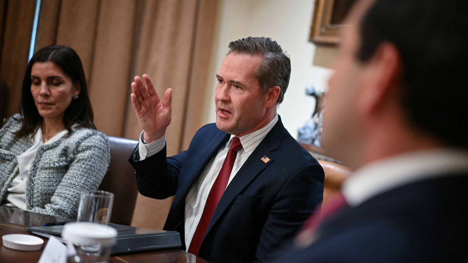 National Security Advisor Mike Waltz gestures as he speaks during a meeting.