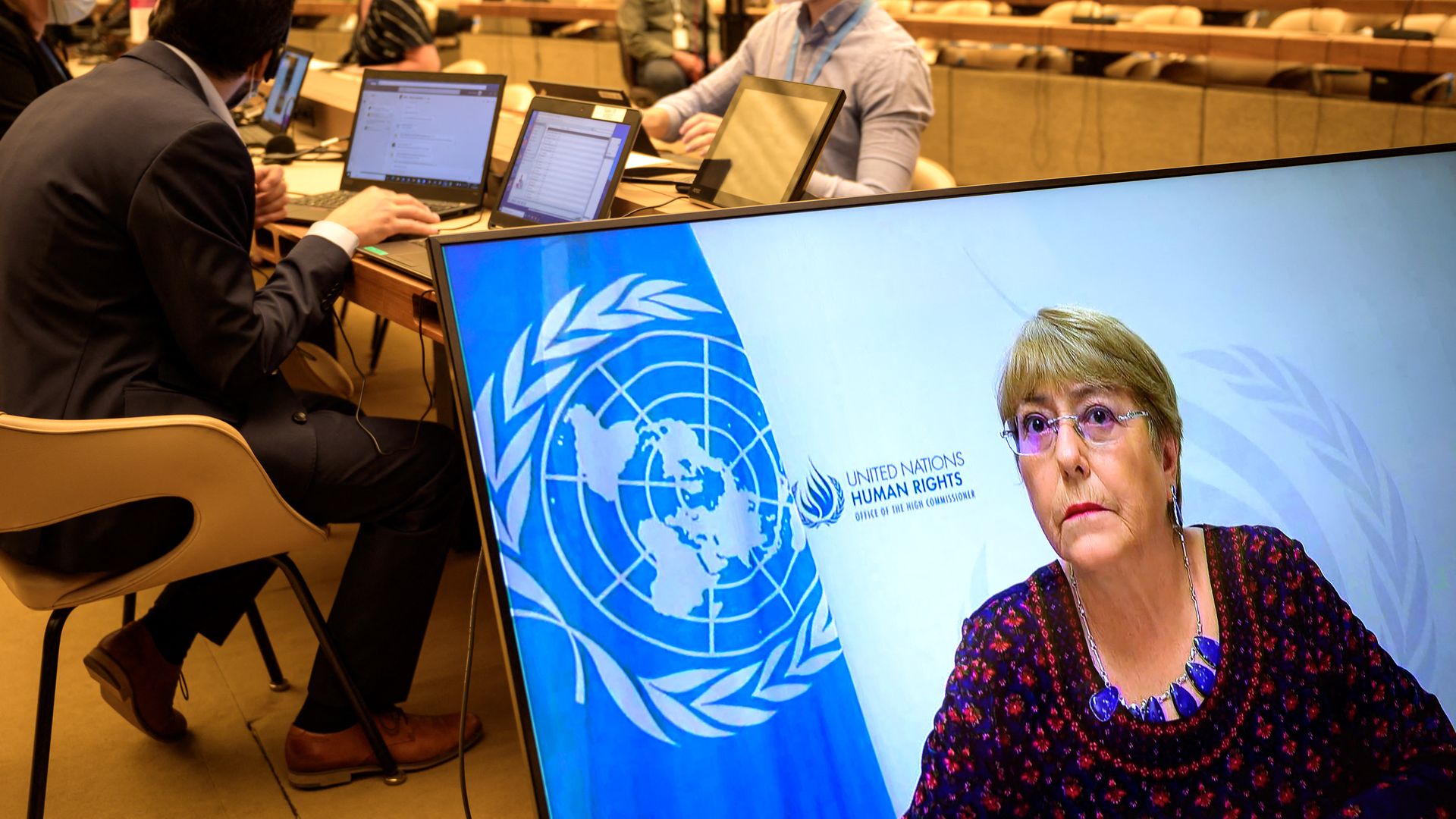 United Nations High Commissioner for Human Rights Michelle Bachelet is seen on a screen delivering her speech remotely