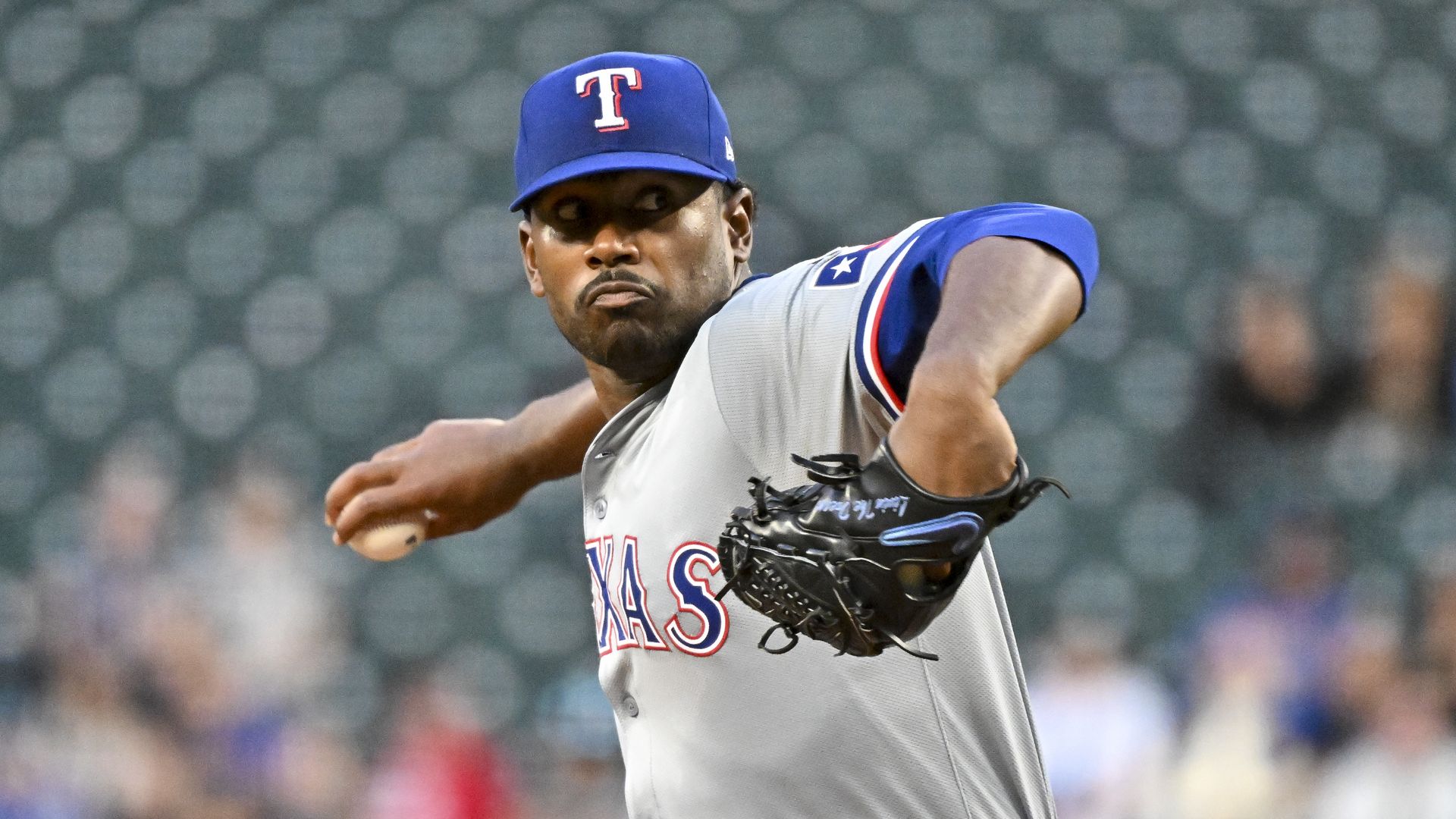A baseball player prepares to pitch